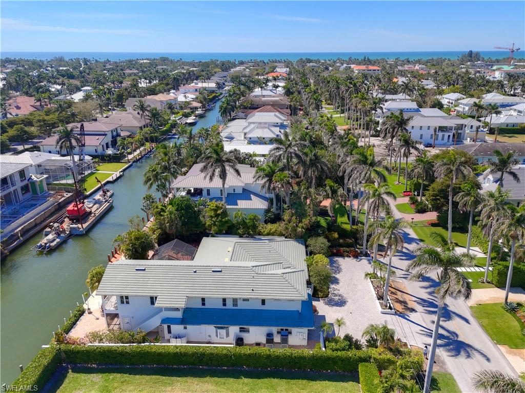 660 14th Avenue South Naples, FL 34102 - Photo 5 of 50 an aerial view of residential houses with outdoor space and swimming pool