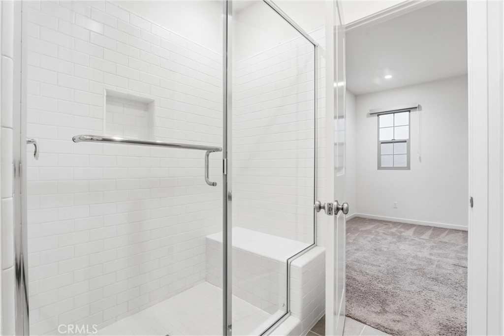 125 Messenger Irvine, CA 92618 - Photo 12 of 19 a bathroom with a shower and a glass door