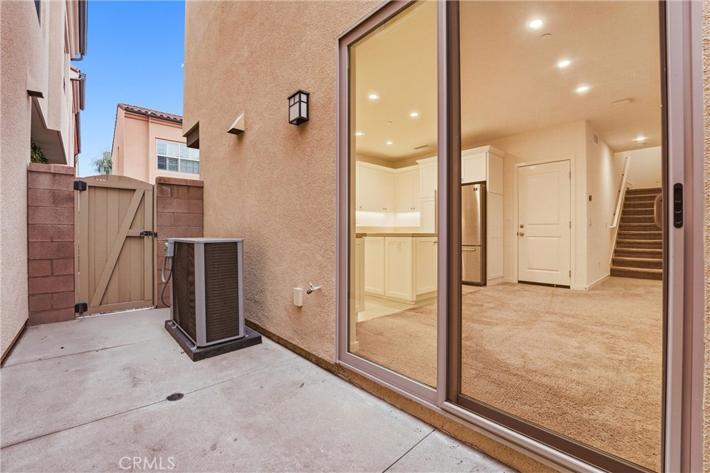 125 Messenger Irvine, CA 92618 - Photo 9 of 19 hallway with wooden floor and glass door shower