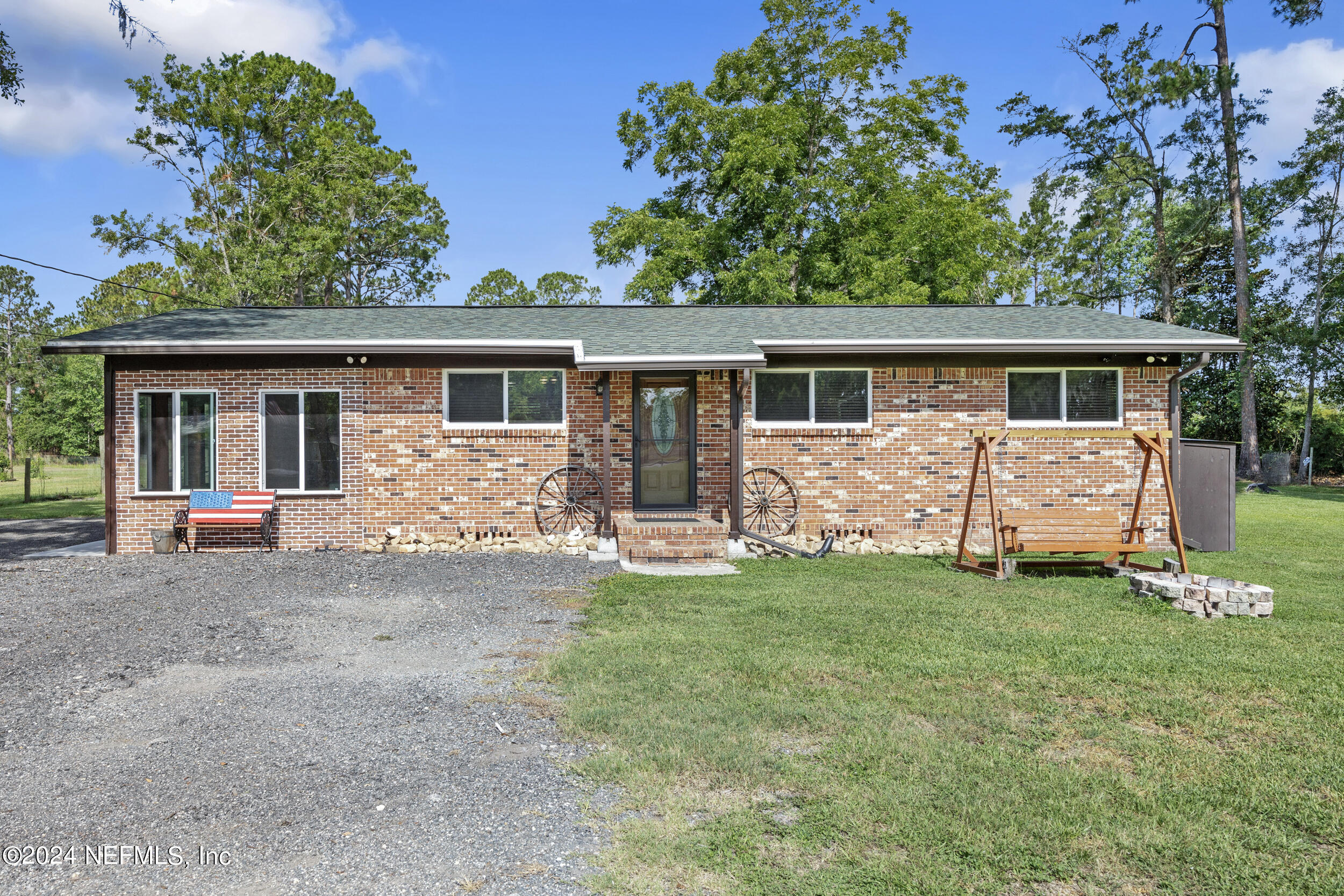 8912 McClelland Road Jacksonville, FL 32234 - Photo 1 of 49 front view of a house with a yard