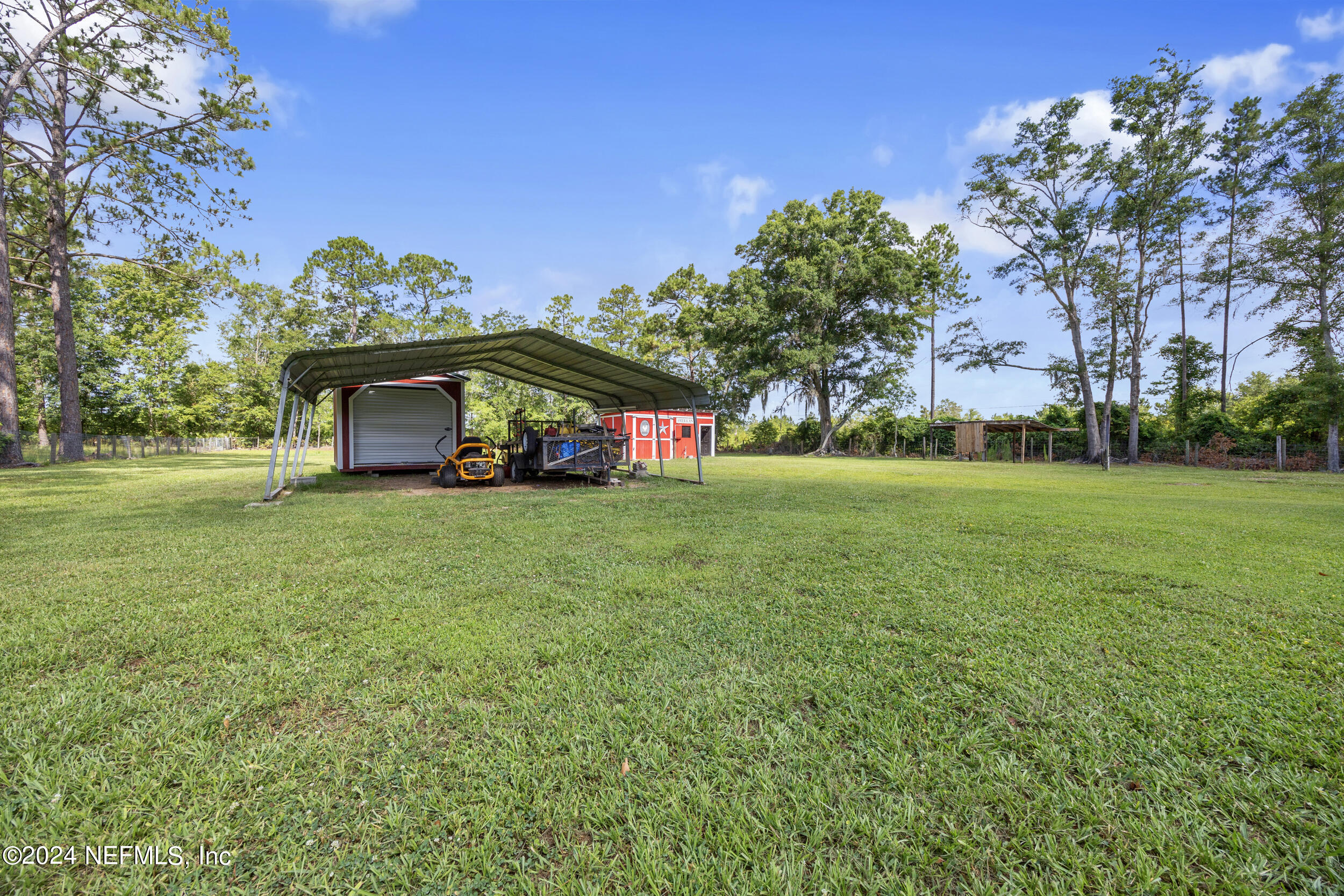 8912 McClelland Road Jacksonville, FL 32234 - Photo 17 of 49 a front view of a house with a yard