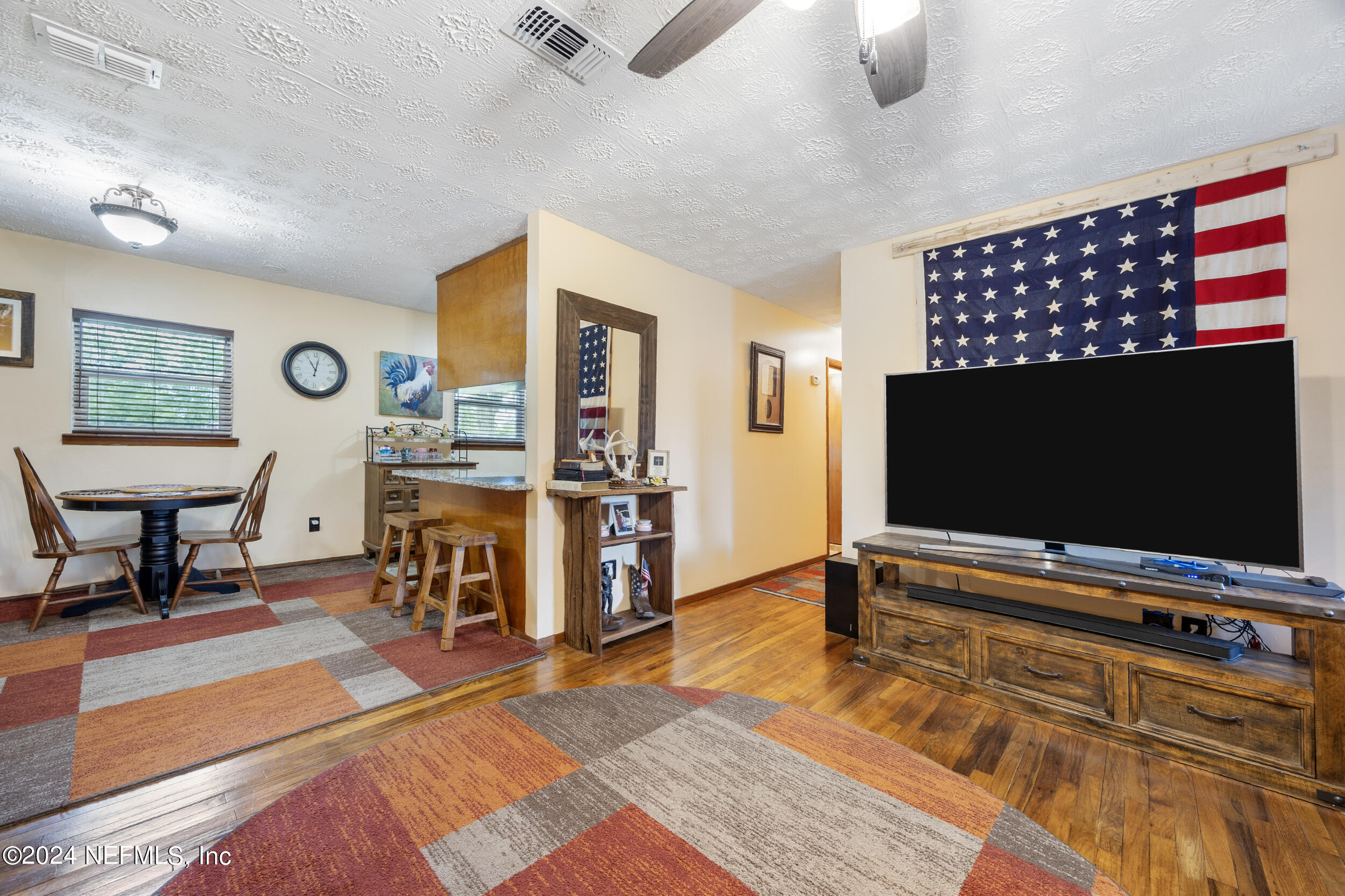 8912 McClelland Road Jacksonville, FL 32234 - Photo 23 of 49 a living room with furniture and a flat screen tv