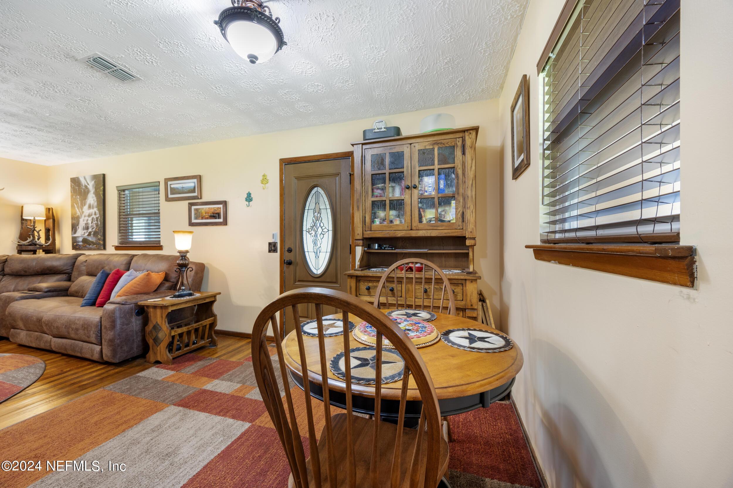 8912 McClelland Road Jacksonville, FL 32234 - Photo 28 of 49 a living room with furniture and a window