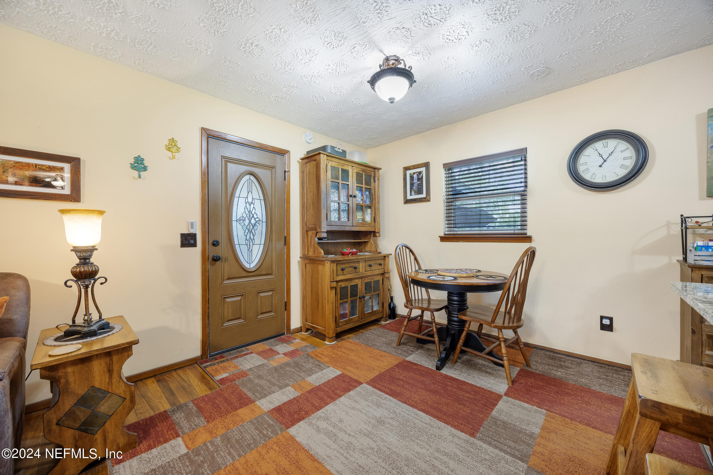 8912 McClelland Road Jacksonville, FL 32234 - Photo 29 of 49 a view of a workspace with furniture and lamp
