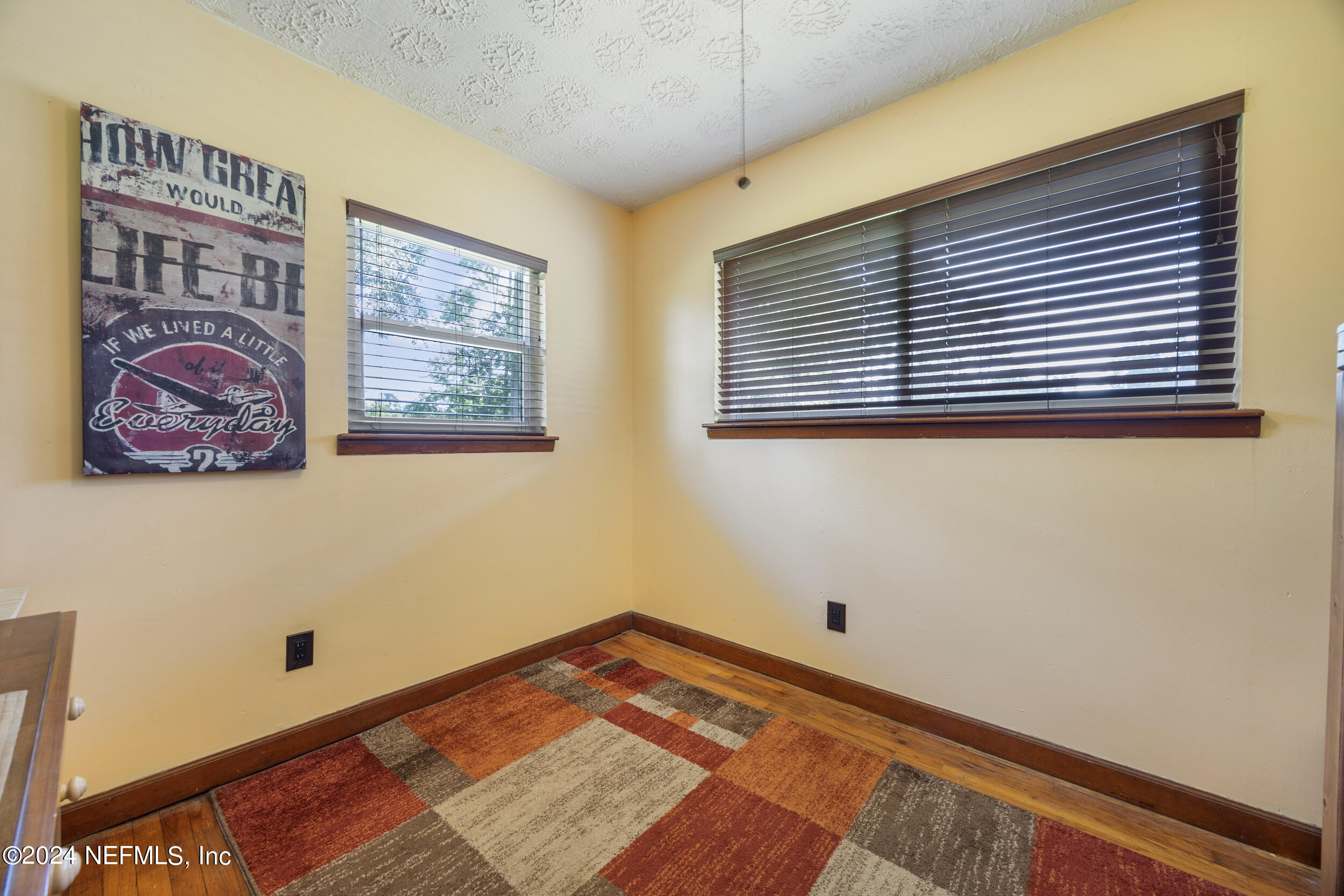 8912 McClelland Road Jacksonville, FL 32234 - Photo 34 of 49 a view of a room with wooden floor and a window