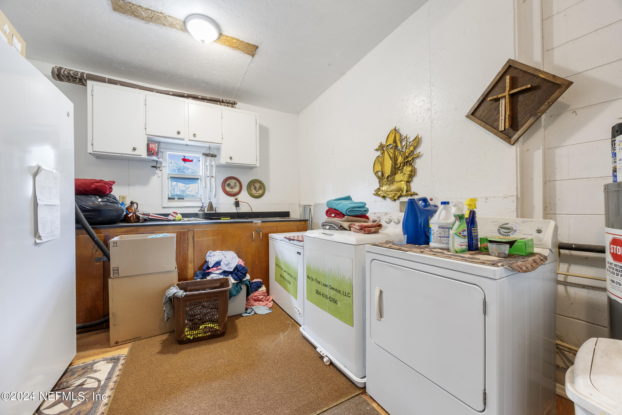 8912 McClelland Road Jacksonville, FL 32234 - Photo 39 of 49 a room with storage and utility