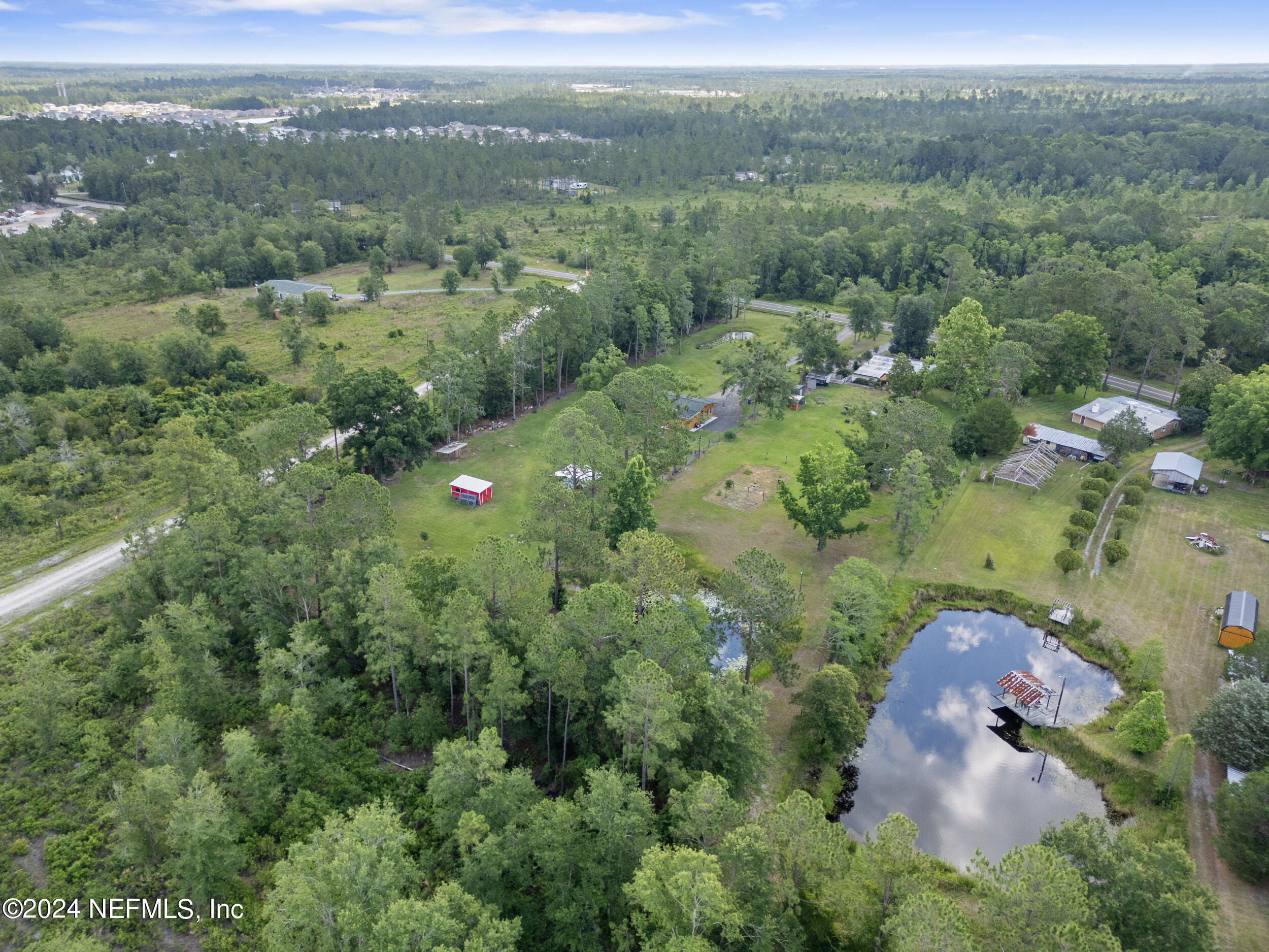 8912 McClelland Road Jacksonville, FL 32234 - Photo 46 of 49 an aerial view of a house with a yard