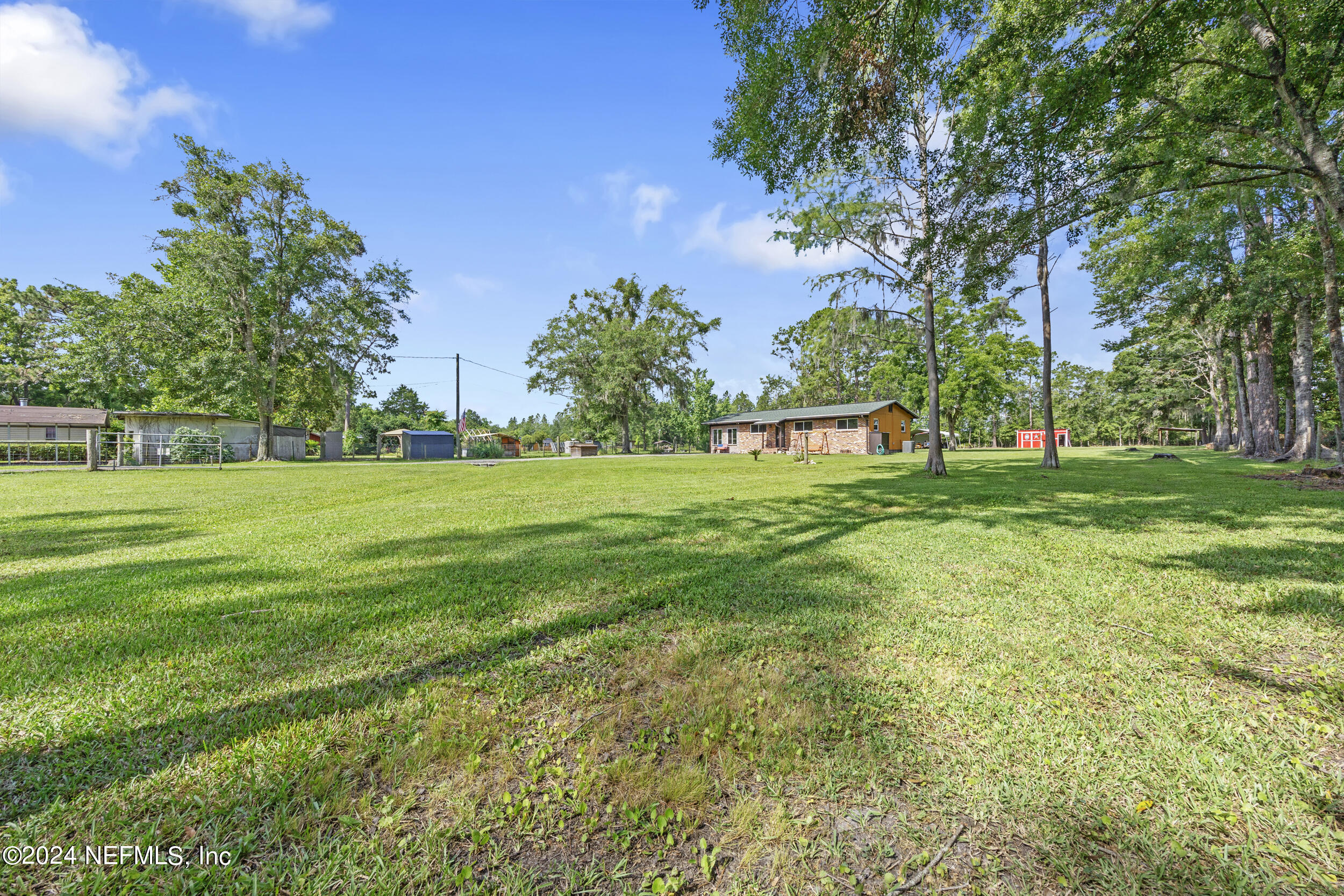 8912 McClelland Road Jacksonville, FL 32234 - Photo 8 of 49 a view of a park with trees and flowers