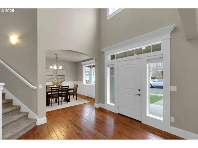 hallway with wooden floor and furniture