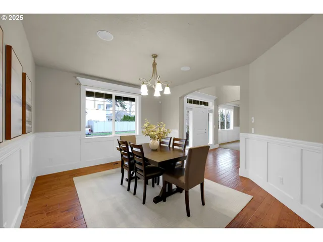 a view of a dining room with furniture and window