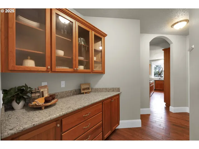 a kitchen with sink and cabinets