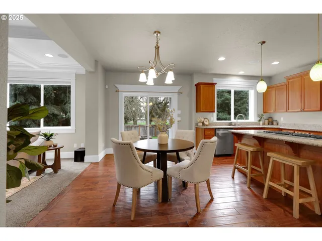 a view of a dining room with furniture window and outside view
