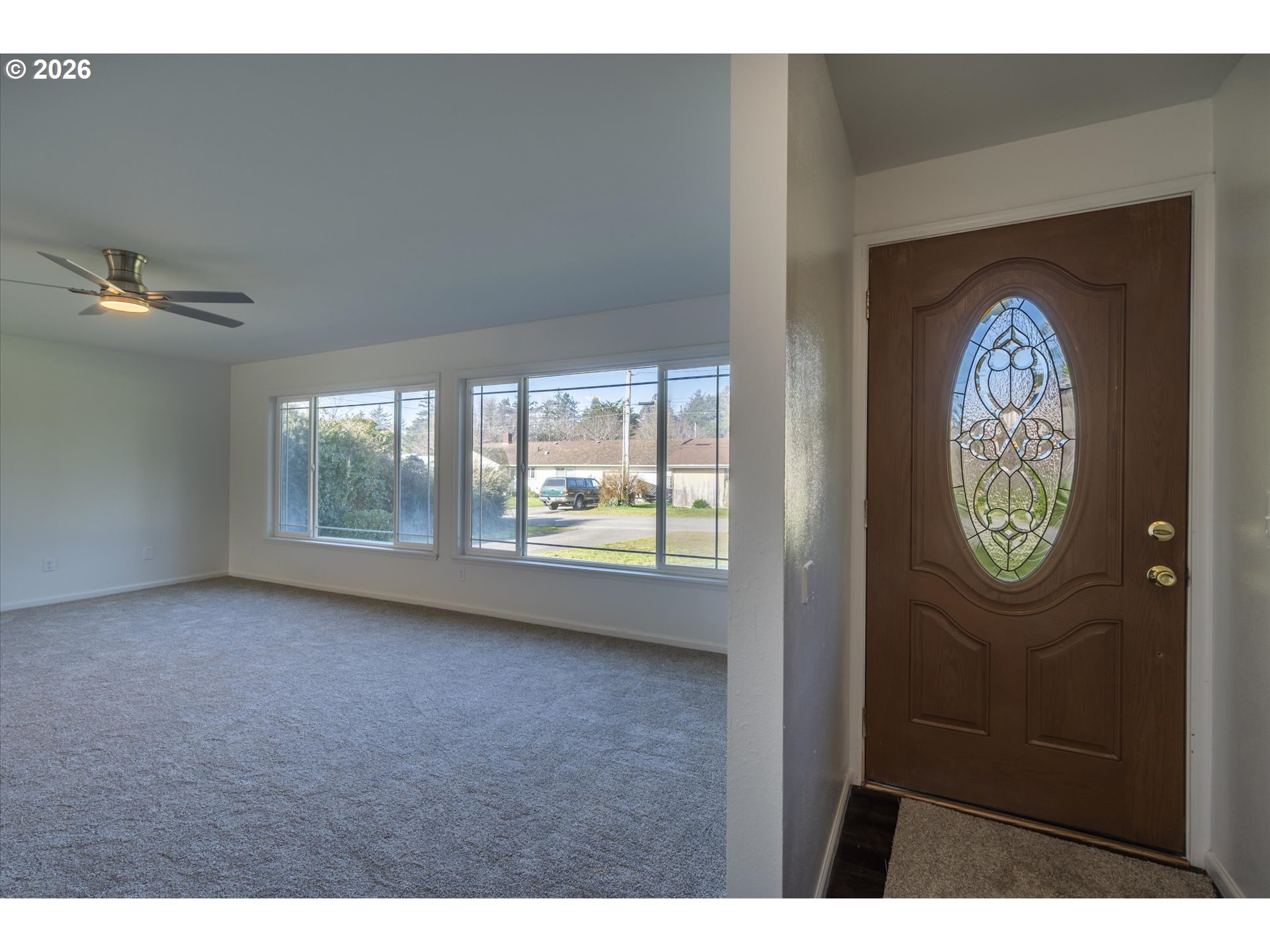 950 1st Street Northeast Bandon, OR 97411 - Photo 3 of 45 a view of a hallway with an window