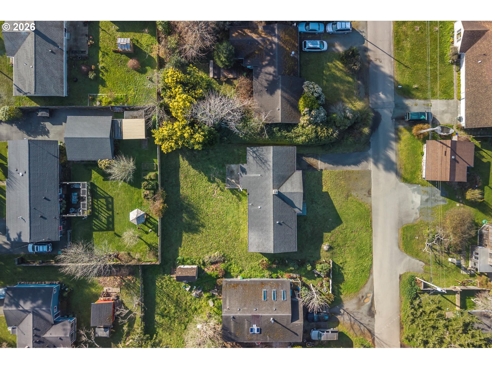 950 1st Street Northeast Bandon, OR 97411 - Photo 35 of 45 an aerial view of houses with outdoor space