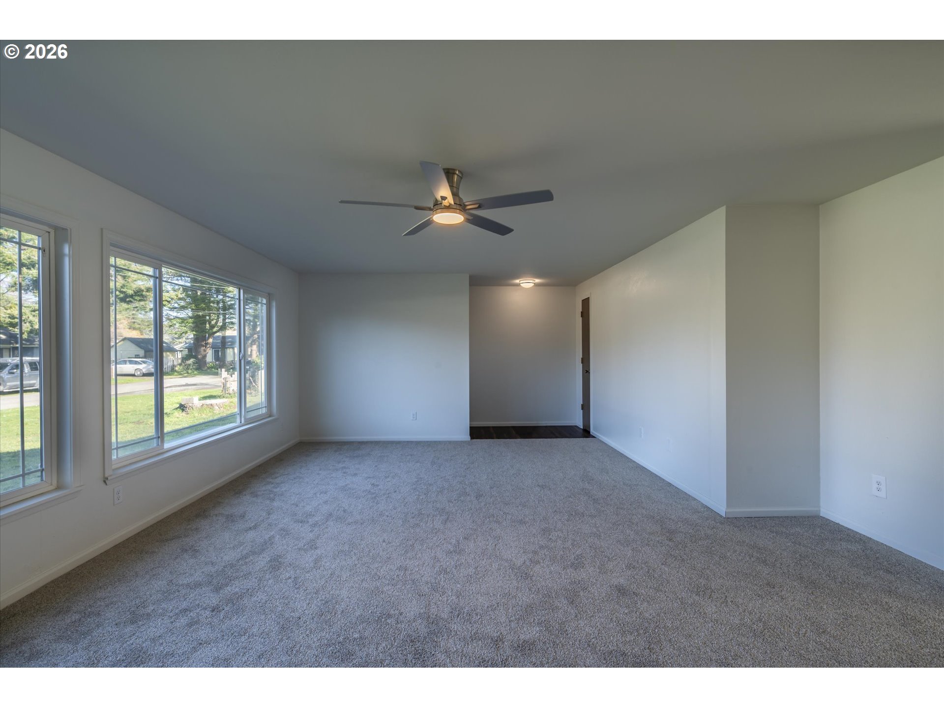 950 1st Street Northeast Bandon, OR 97411 - Photo 4 of 45 a view of a livingroom with a ceiling fan and window