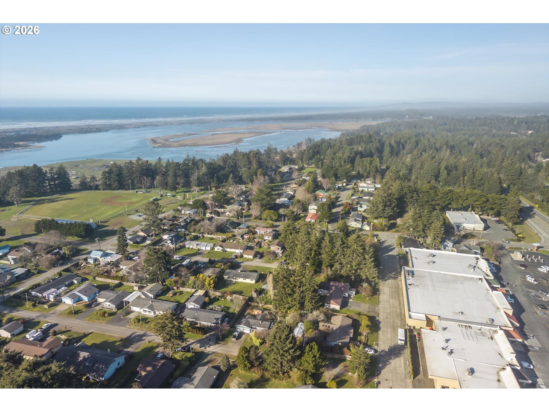 950 1st Street Northeast Bandon, OR 97411 - Photo 43 of 45 an aerial view of residential building and ocean