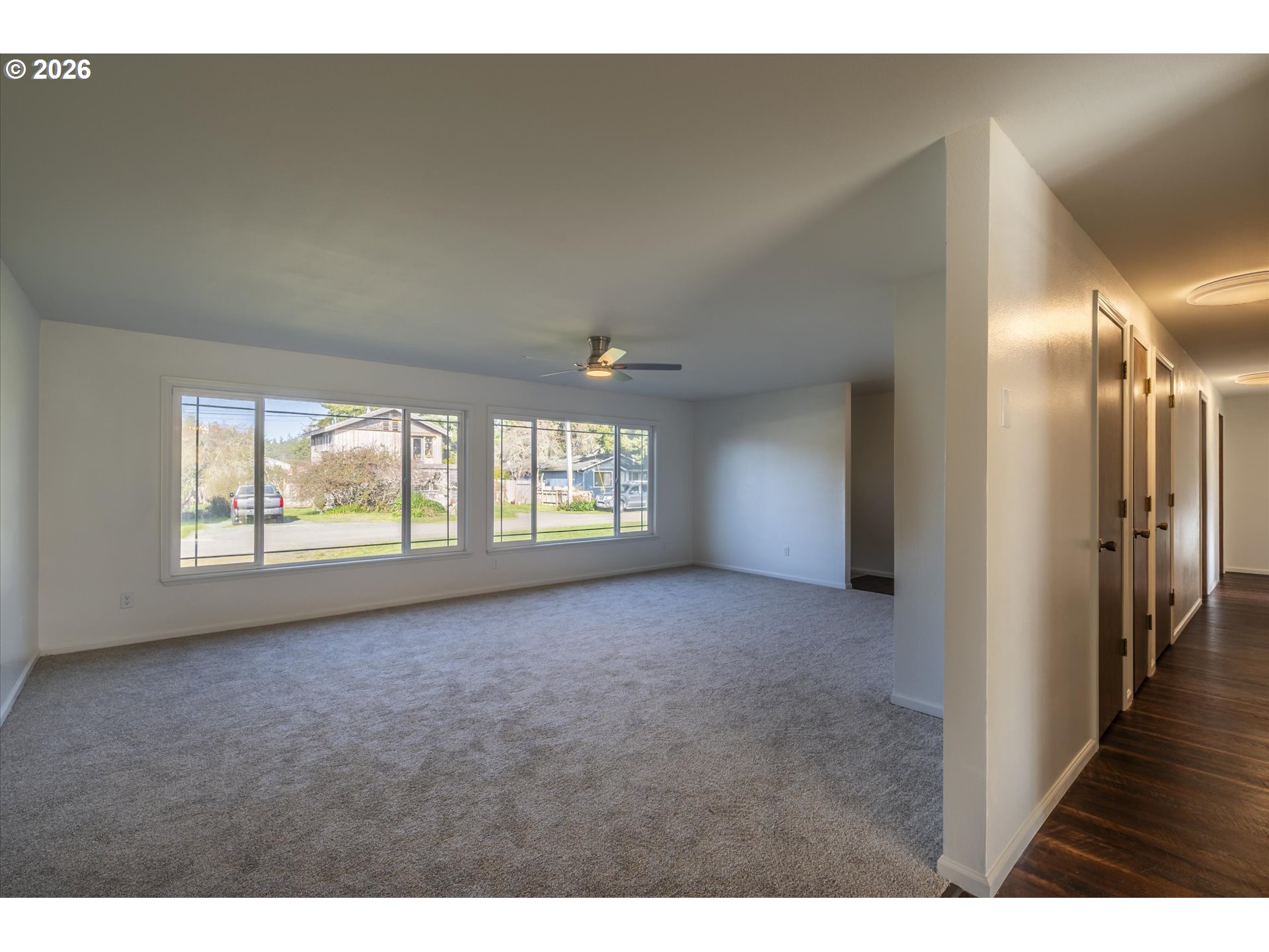 950 1st Street Northeast Bandon, OR 97411 - Photo 5 of 45 a view of an empty room with a window