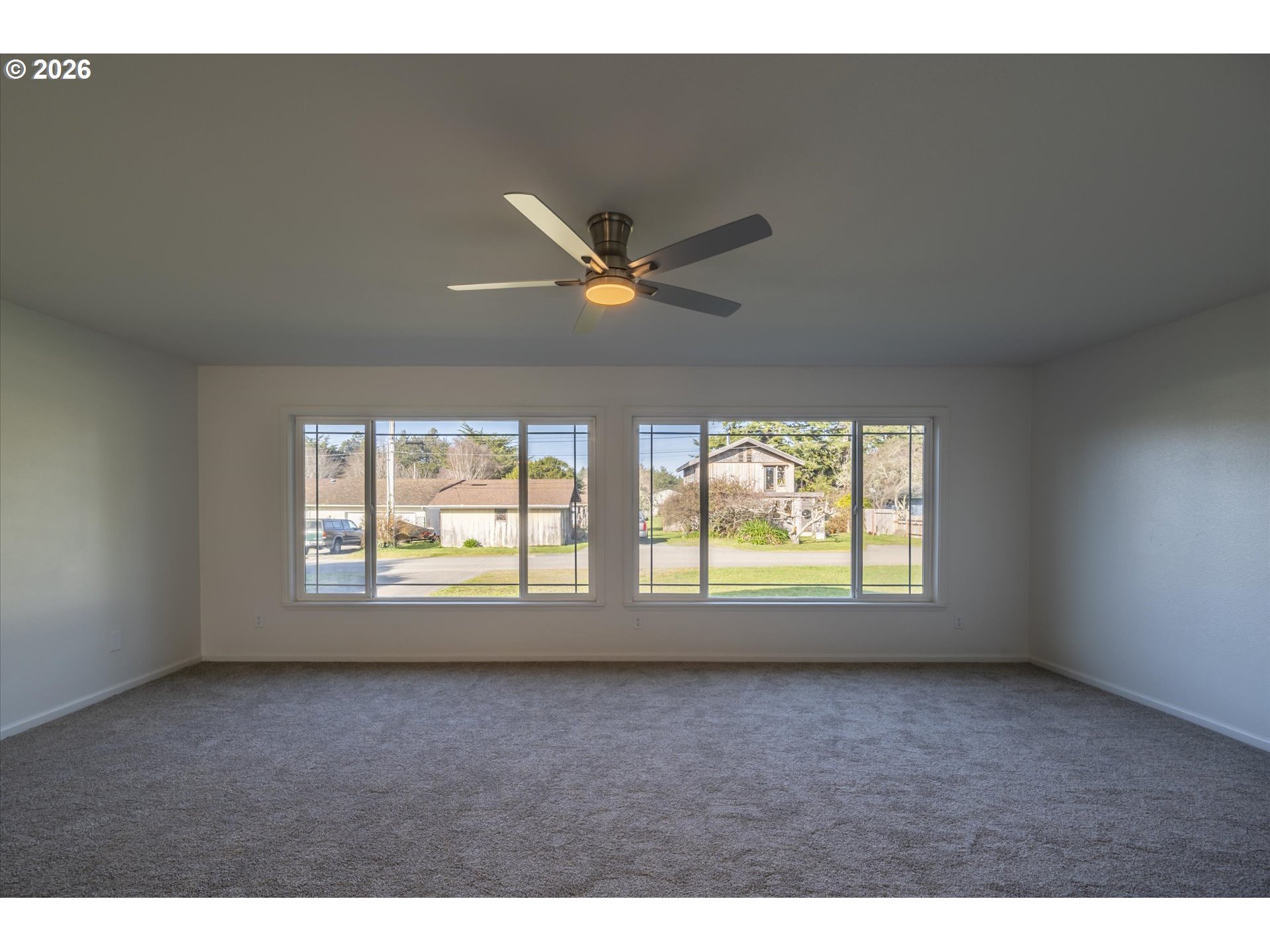 950 1st Street Northeast Bandon, OR 97411 - Photo 6 of 45 a view of an empty room with a window