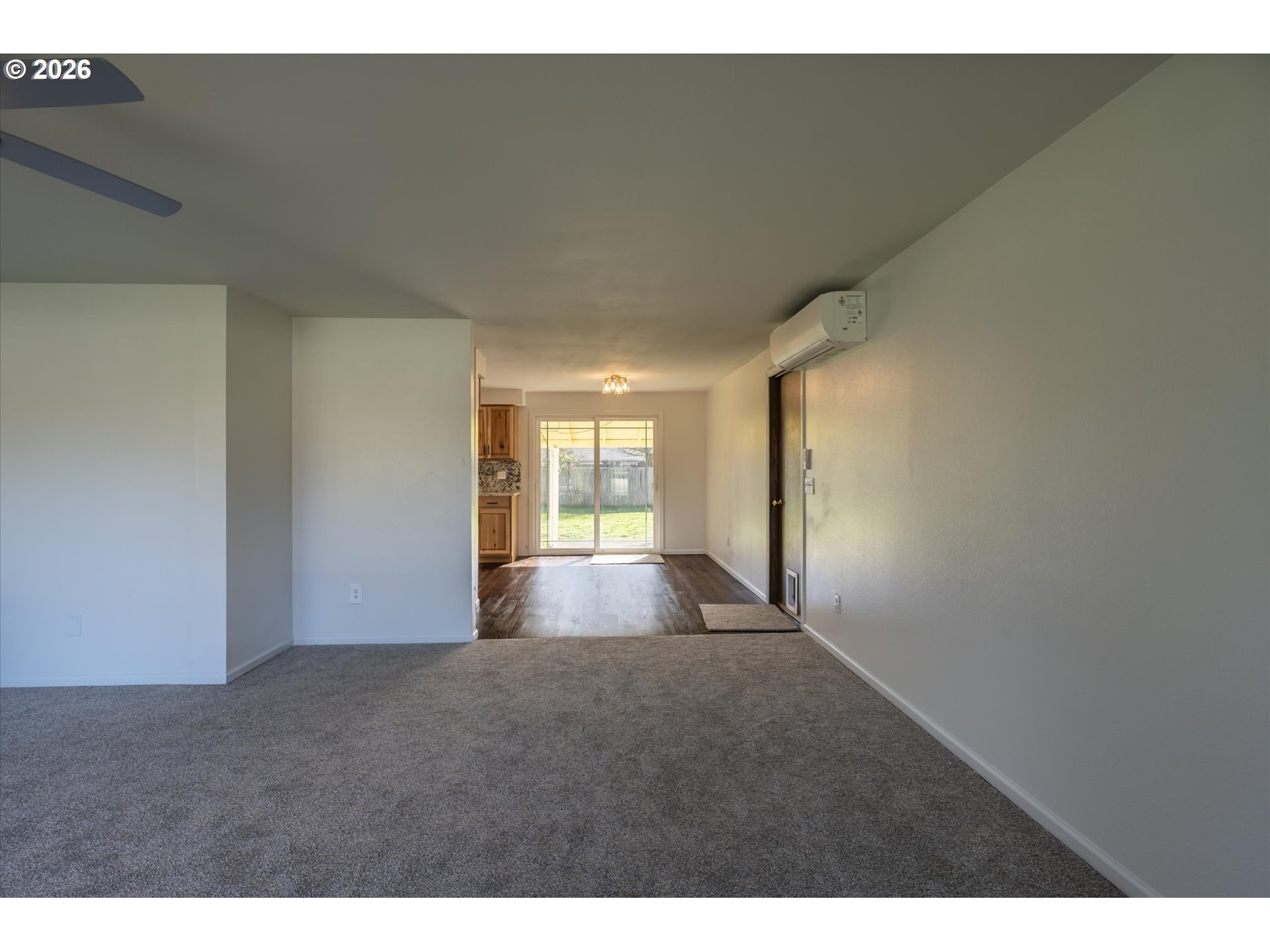 950 1st Street Northeast Bandon, OR 97411 - Photo 9 of 45 a view of empty room with wooden floor