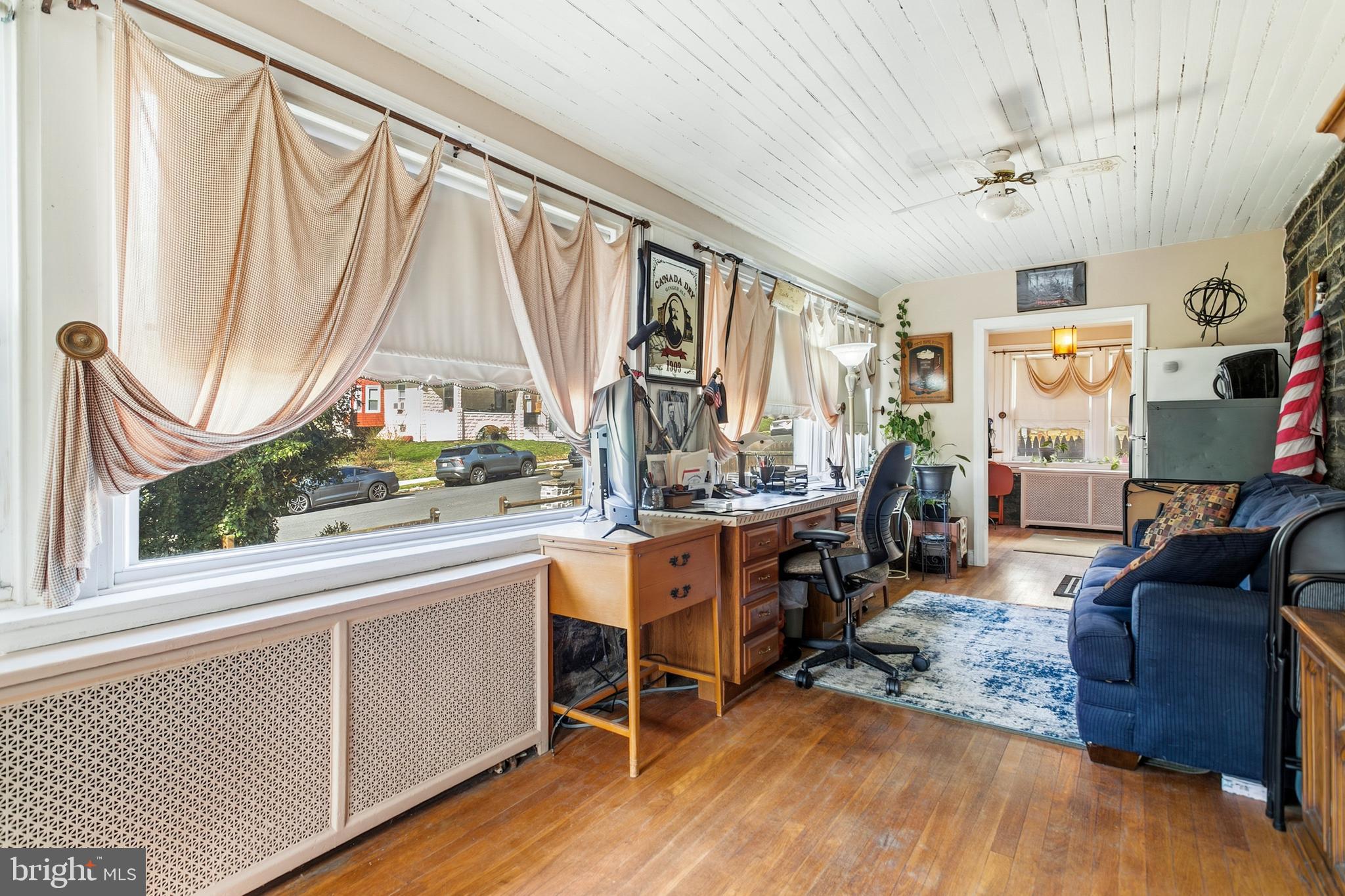 341 Owen Avenue Lansdowne, PA 19050 - Photo 11 of 58 a living room with furniture a large window and wooden floor