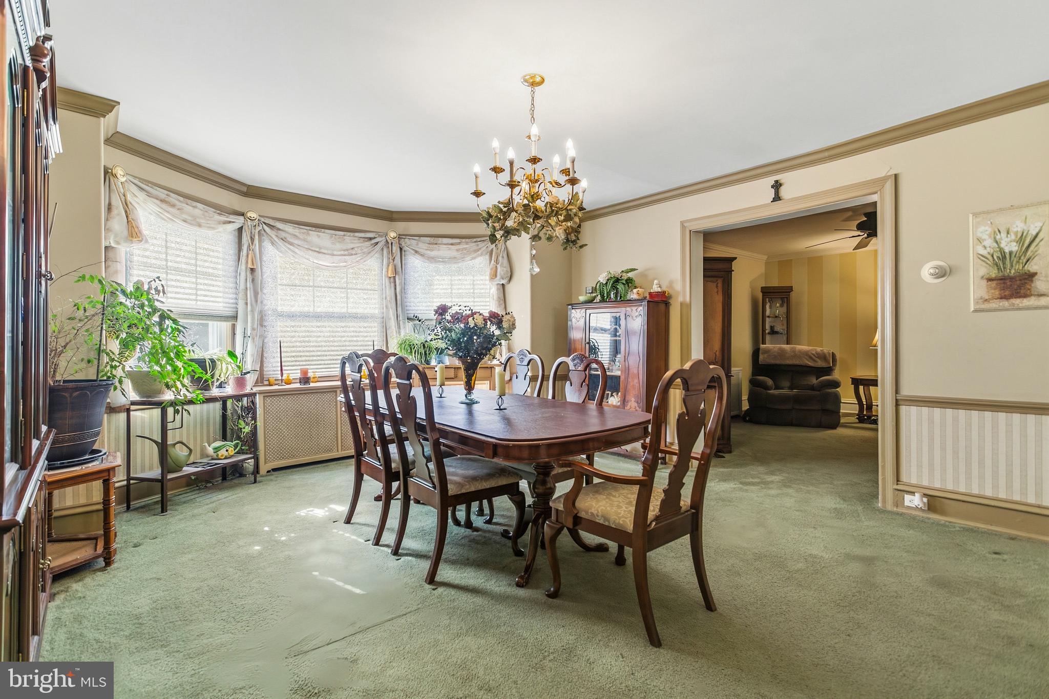 341 Owen Avenue Lansdowne, PA 19050 - Photo 15 of 58 a dining room with furniture potted plants and wooden floor