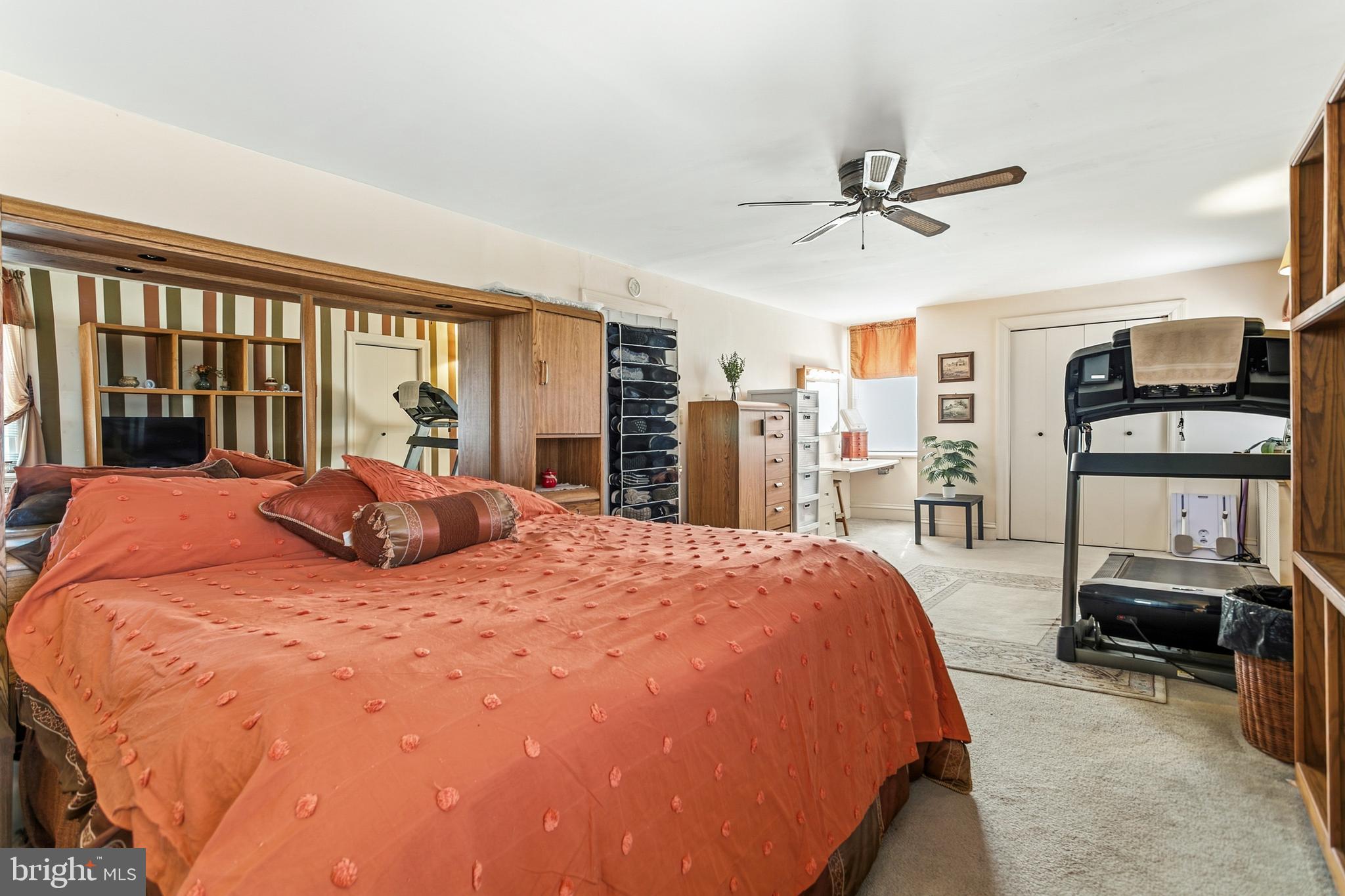 341 Owen Avenue Lansdowne, PA 19050 - Photo 24 of 58 a large bedroom with a bed and glass walk in closet