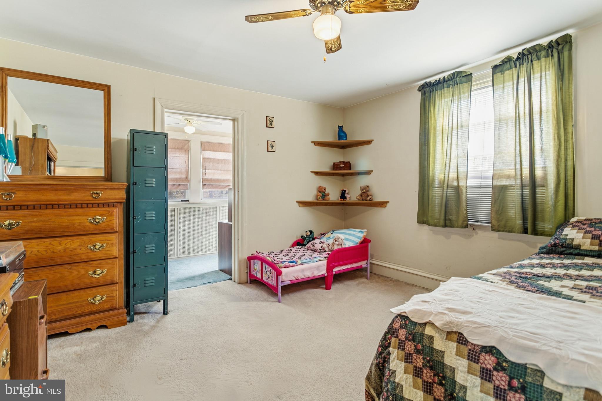 341 Owen Avenue Lansdowne, PA 19050 - Photo 27 of 58 a bedroom with a bed and a chandelier