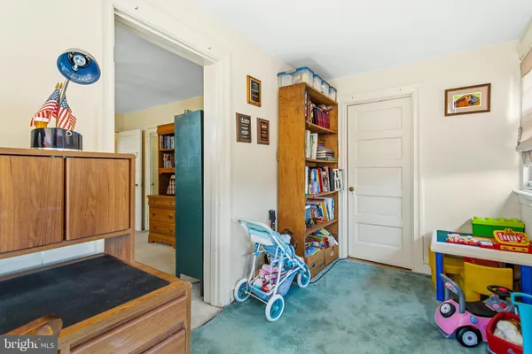 a bed room with a bed and a chair