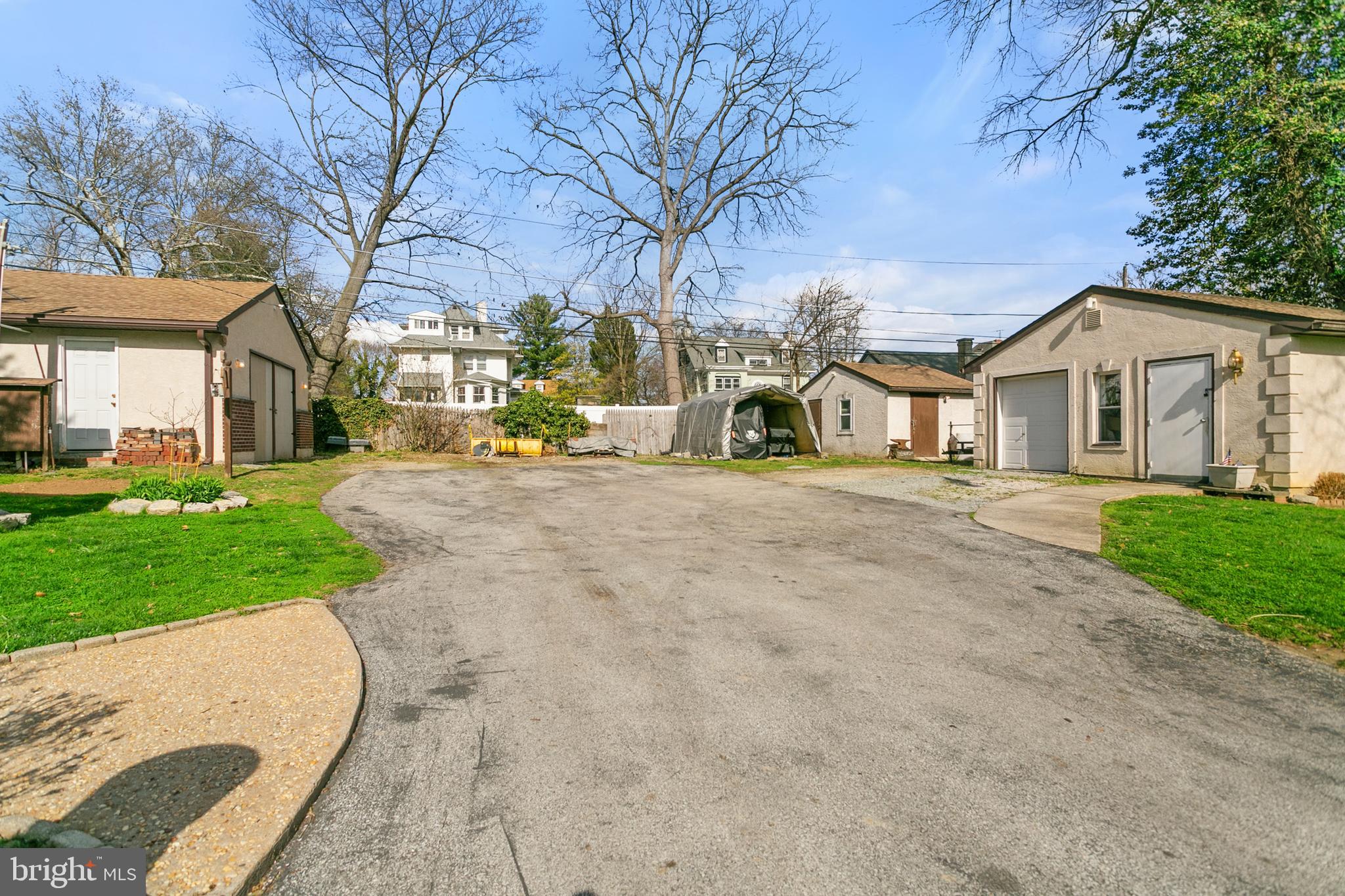 341 Owen Avenue Lansdowne, PA 19050 - Photo 41 of 58 a view of a white house with a big yard and large trees