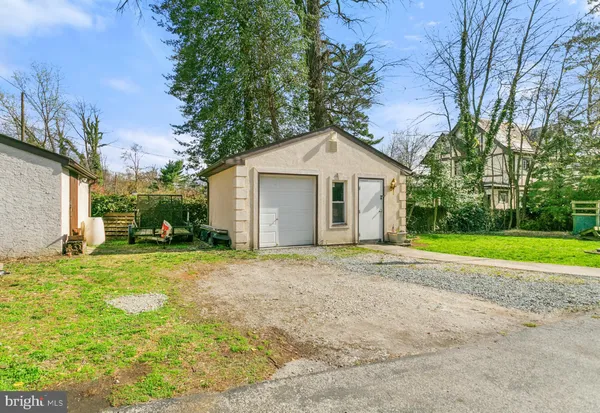 a house view with a play ground in front of it