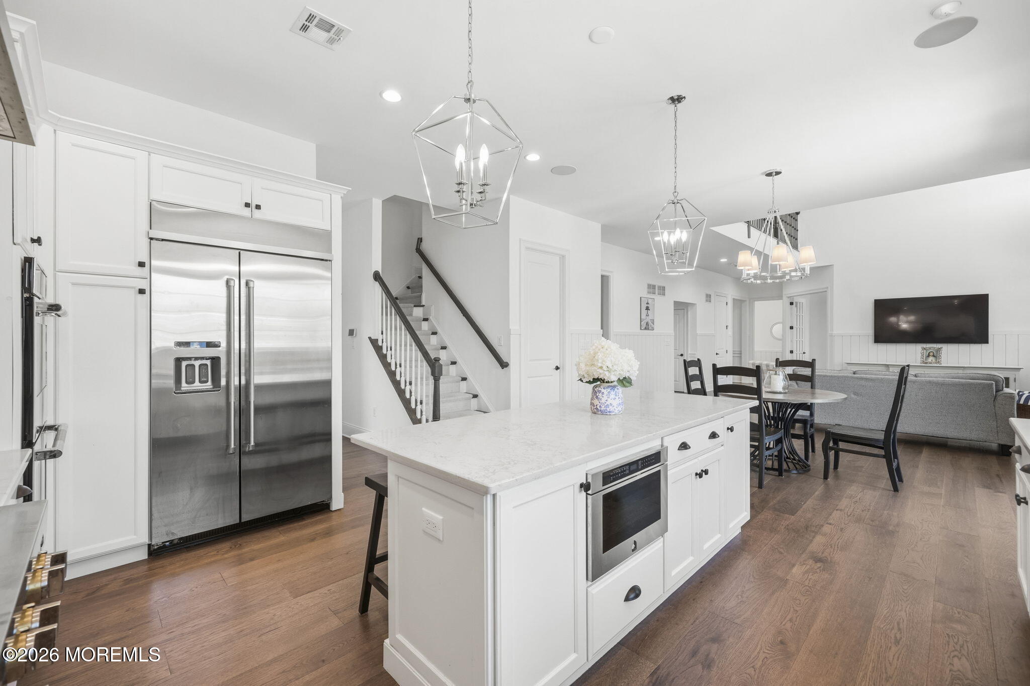 66 Windermere Road Lincroft, NJ 07738 - Photo 13 of 48 a kitchen with stainless steel appliances a stove a sink a refrigerator and a fireplace