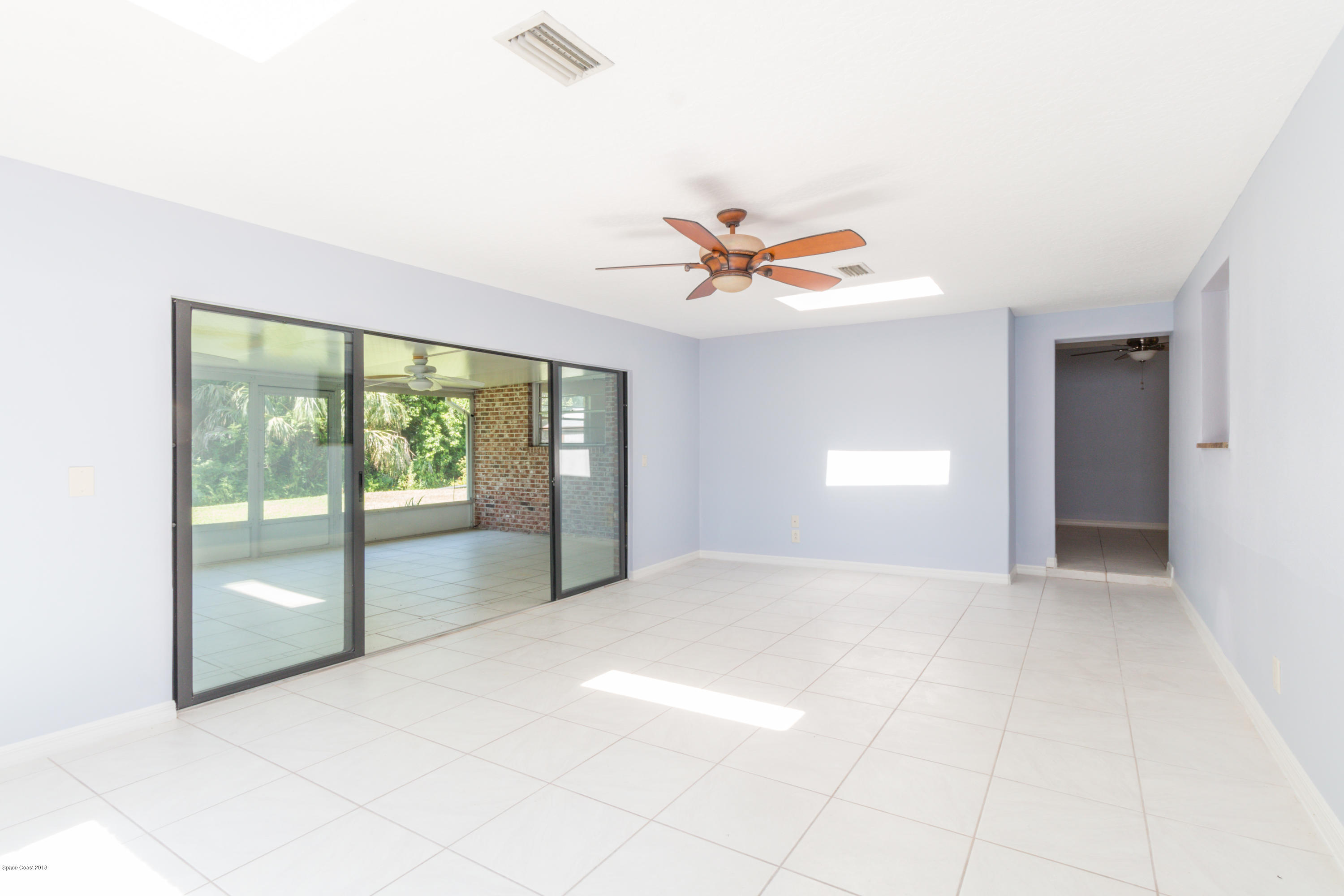 1208 Cimarron Circle Northeast Palm Bay, FL 32905 - Photo 11 of 41 a view of an empty room with a window