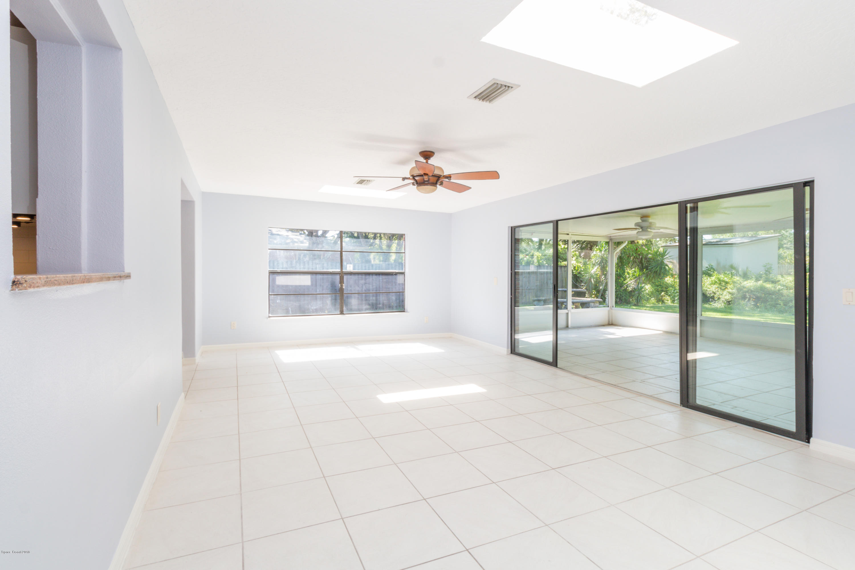1208 Cimarron Circle Northeast Palm Bay, FL 32905 - Photo 12 of 41 a view of an empty room with a window