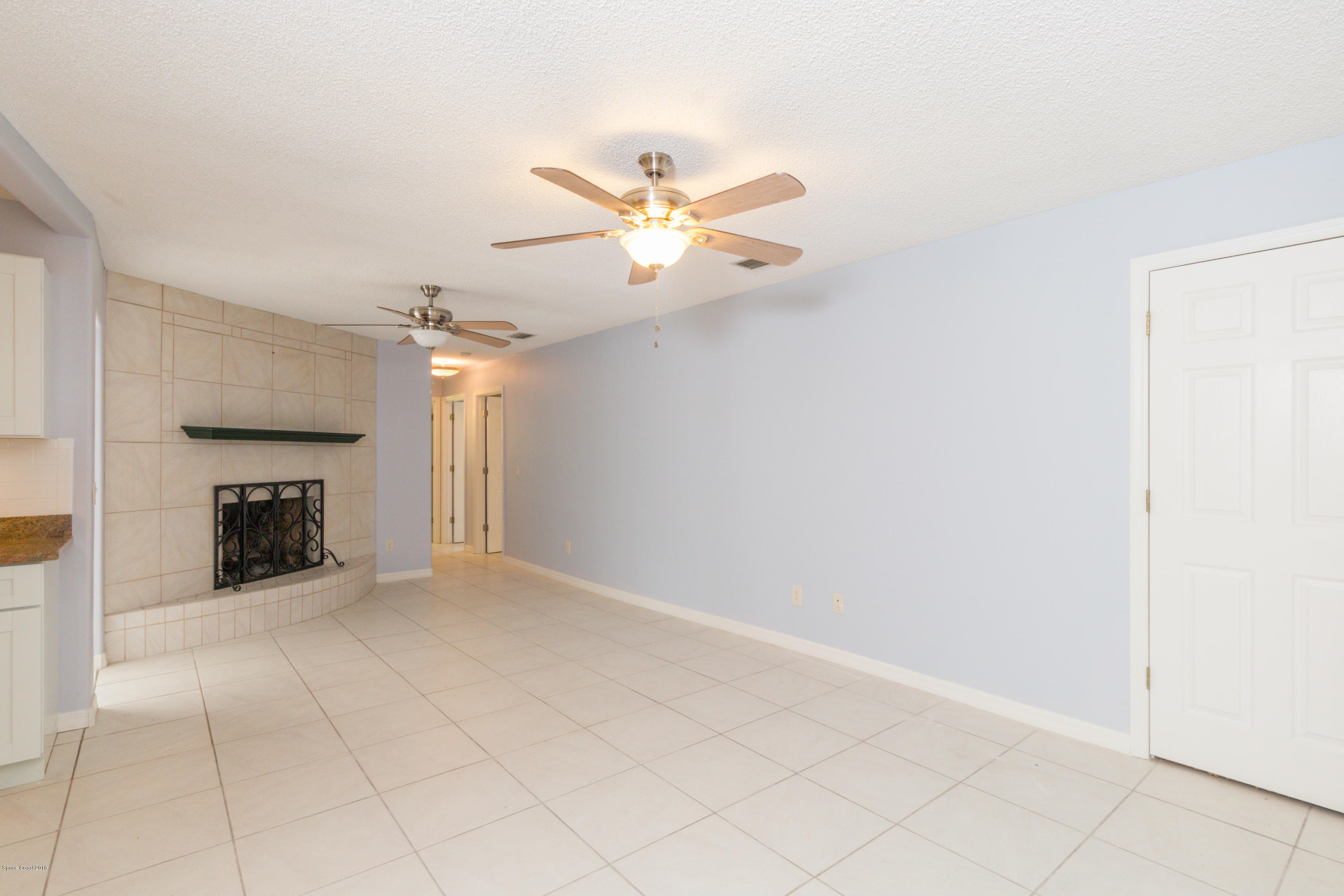 1208 Cimarron Circle Northeast Palm Bay, FL 32905 - Photo 18 of 41 a view of an empty room and fire place
