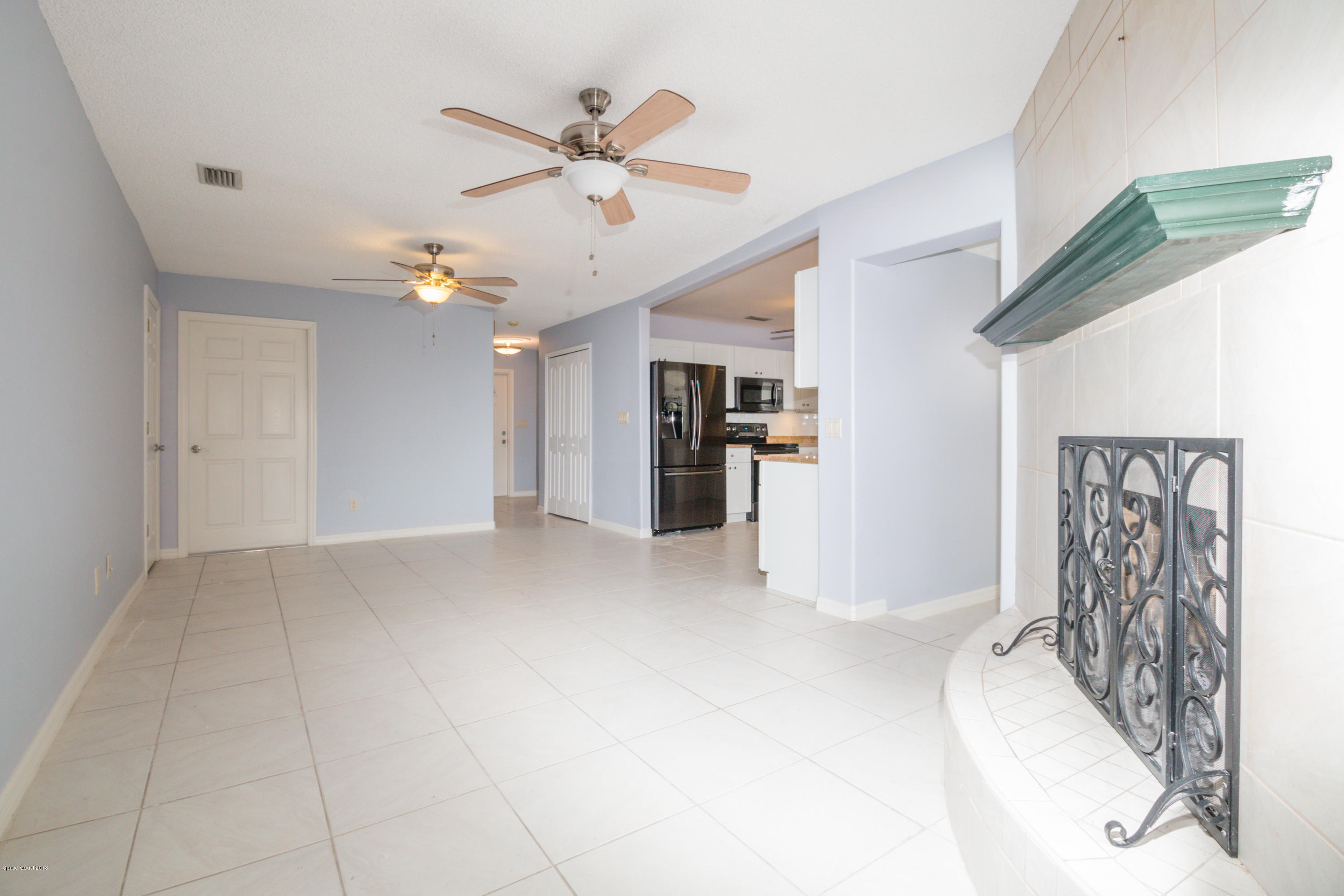 1208 Cimarron Circle Northeast Palm Bay, FL 32905 - Photo 20 of 41 a view of a livingroom with a ceiling fan