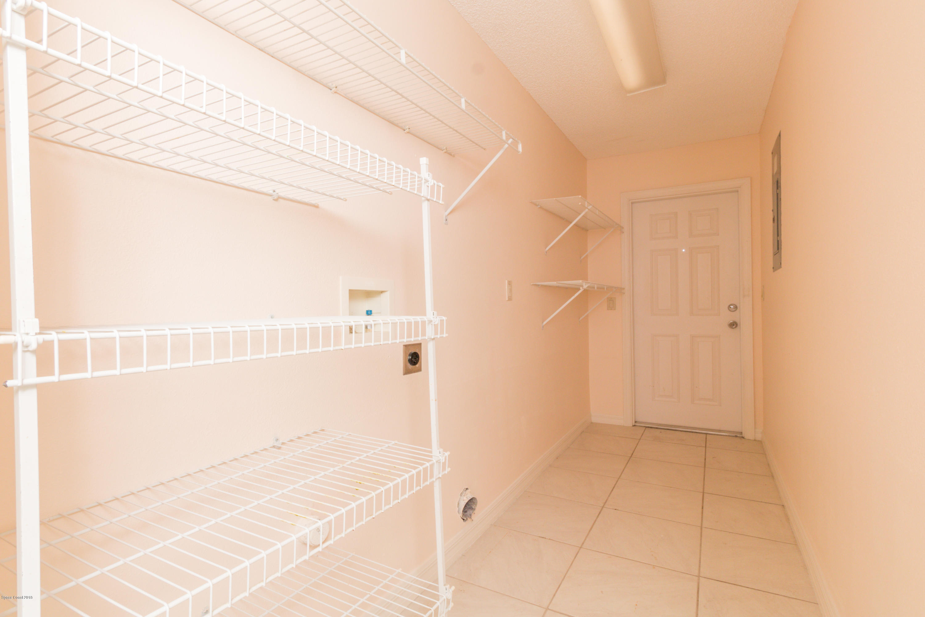 1208 Cimarron Circle Northeast Palm Bay, FL 32905 - Photo 35 of 41 a bathroom with a bathtub and shower
