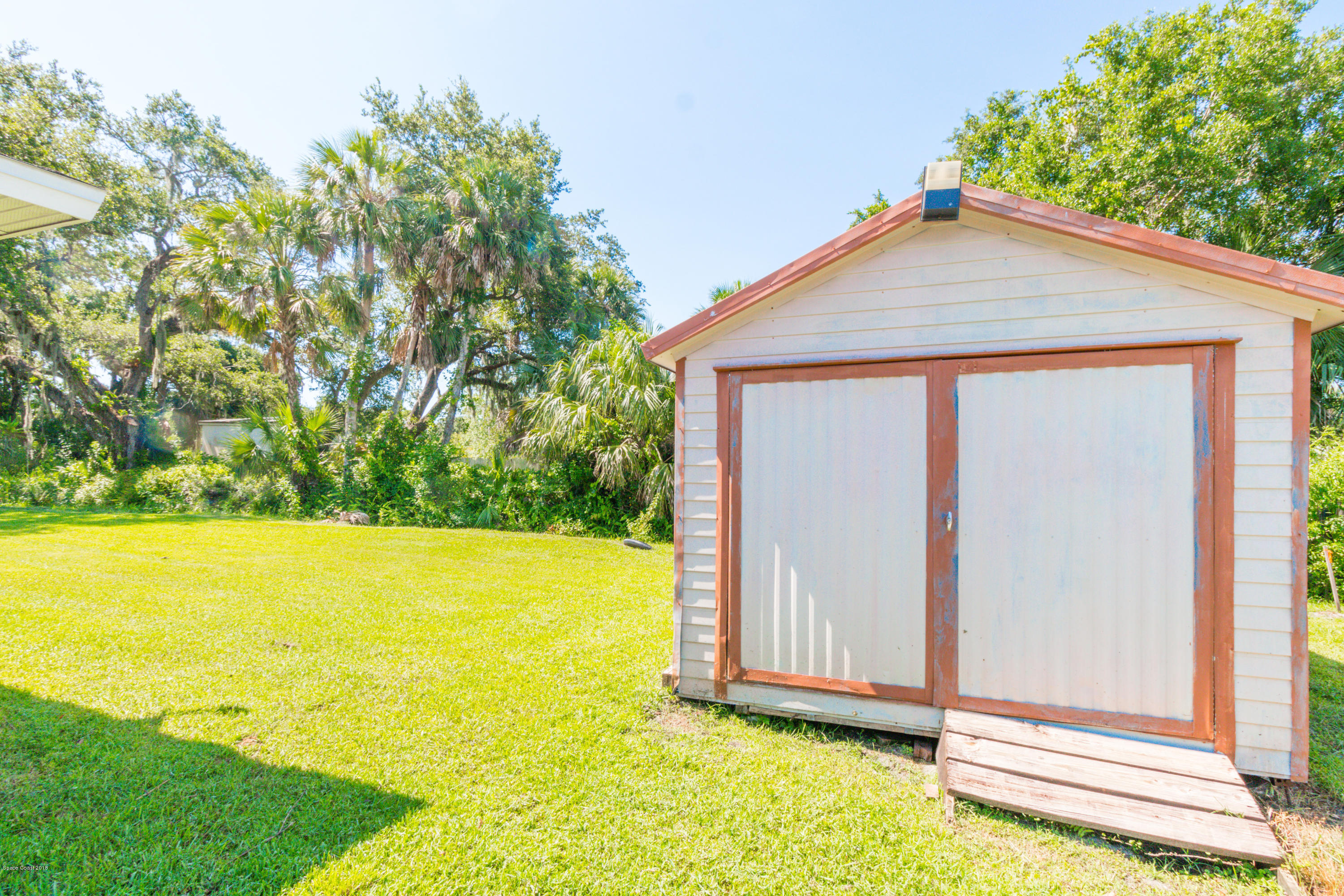 1208 Cimarron Circle Northeast Palm Bay, FL 32905 - Photo 40 of 41 a view of an house with backyard