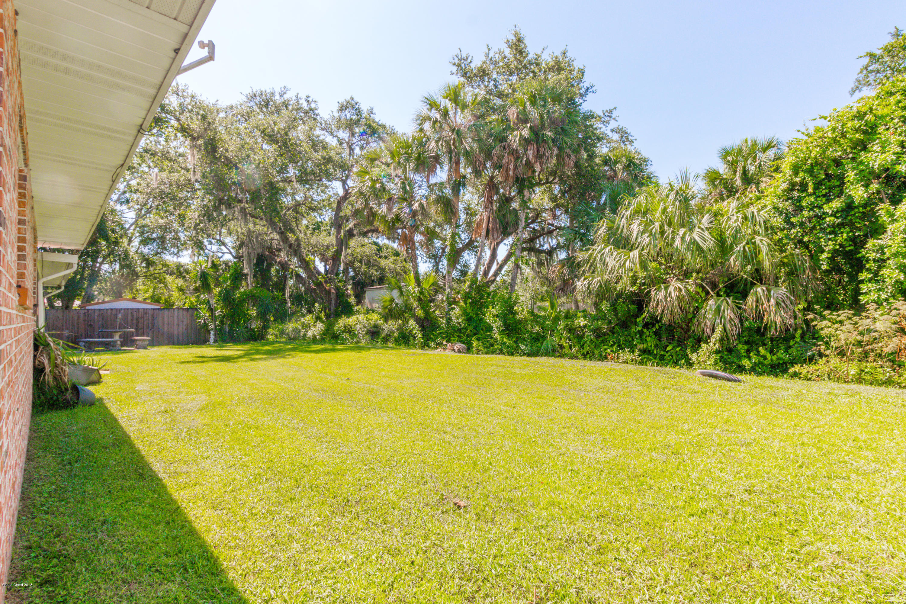 1208 Cimarron Circle Northeast Palm Bay, FL 32905 - Photo 41 of 41 a view of an outdoor space and swimming pool