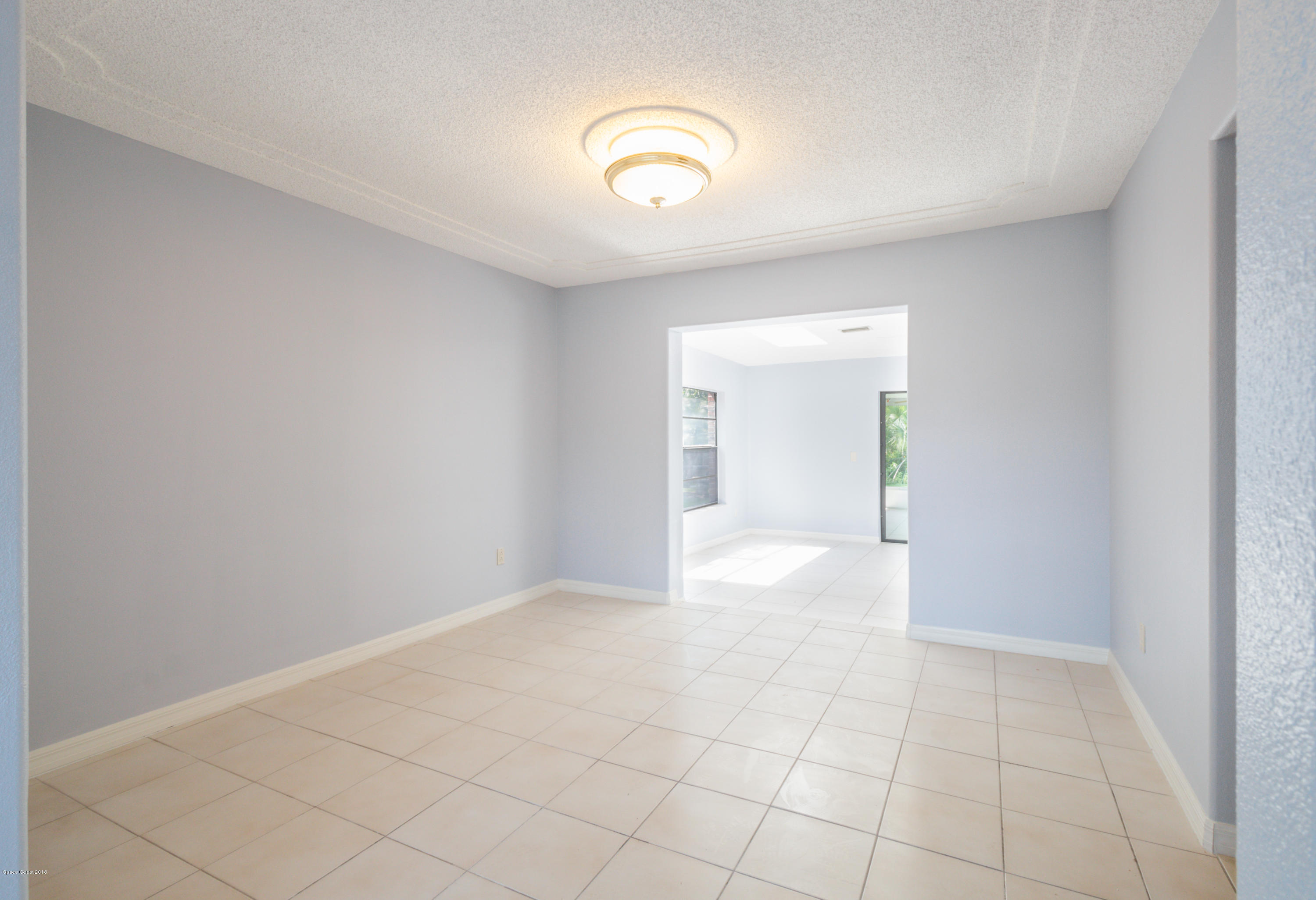 1208 Cimarron Circle Northeast Palm Bay, FL 32905 - Photo 10 of 41 a view of an empty room with window