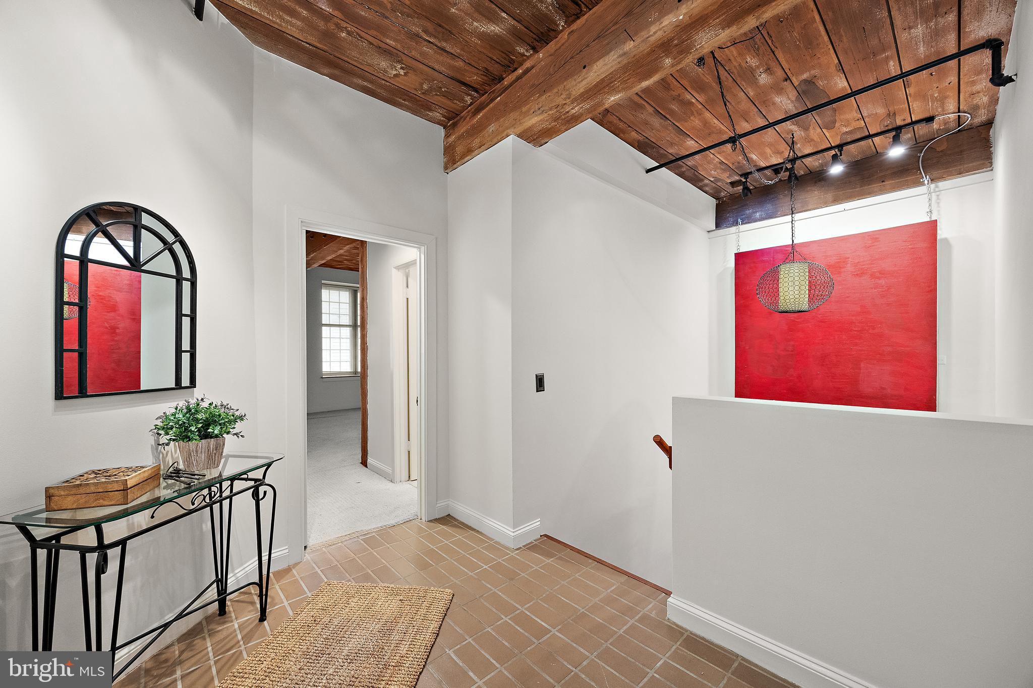49 Bancroft Mills Road, Unit 2I Wilmington, DE 19806 - Photo 18 of 27 a view of entryway with a hallway and wooden floor