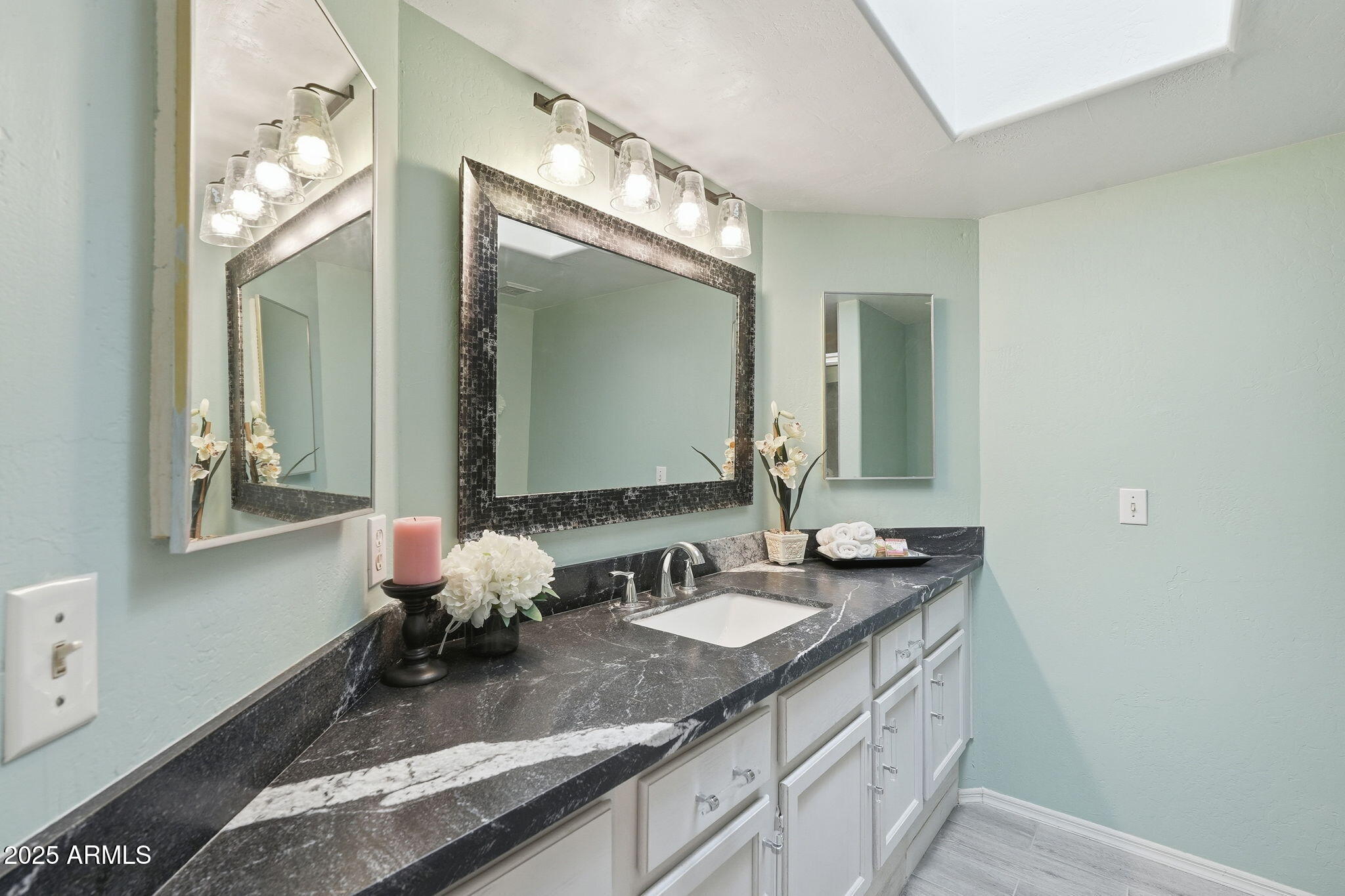 18002 North 12th Street, Unit 26 Phoenix, AZ 85022 - Photo 17 of 25 a bathroom with double vanity and a mirror