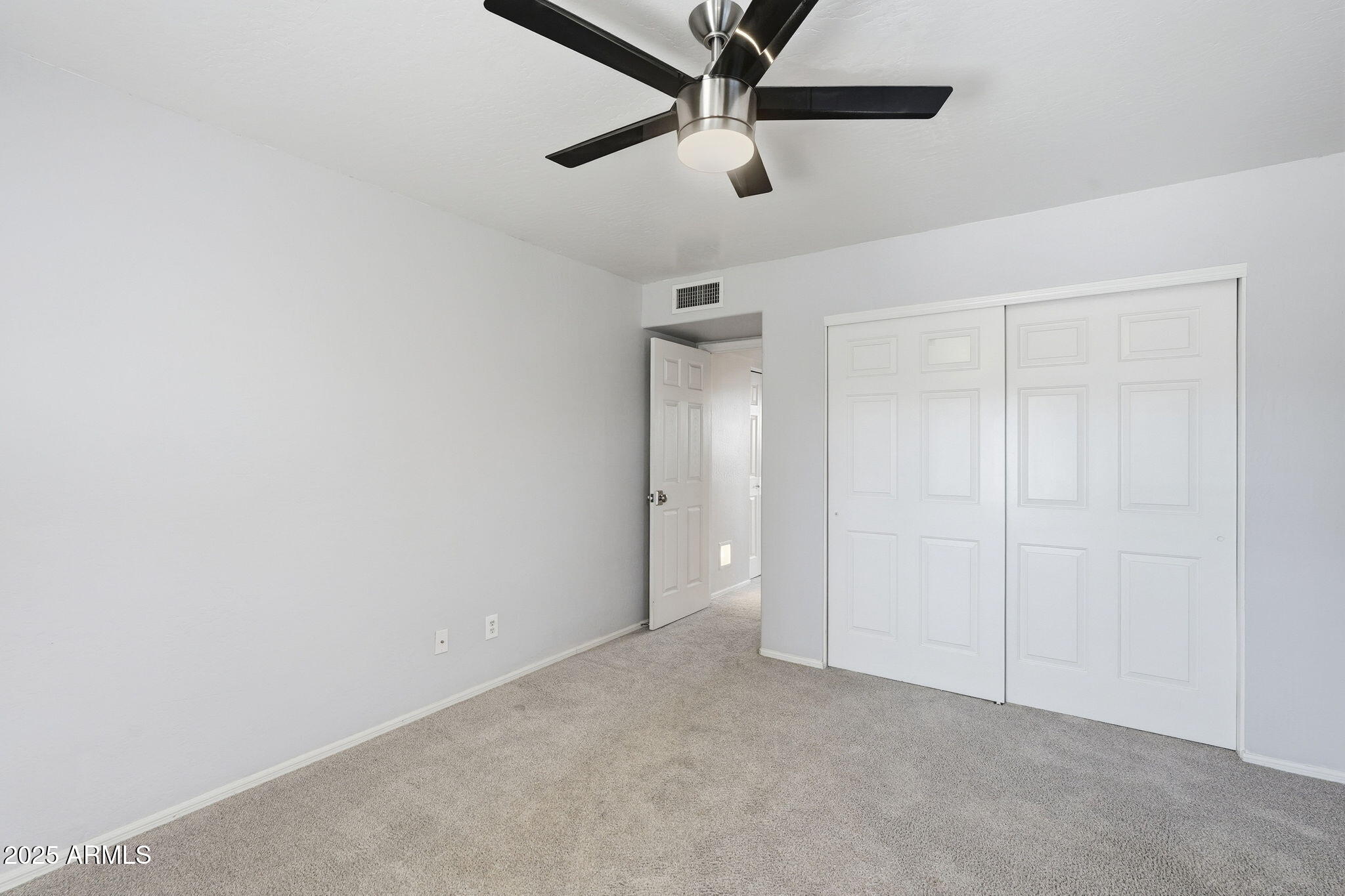 18002 North 12th Street, Unit 26 Phoenix, AZ 85022 - Photo 19 of 25 an empty room with ceiling fan