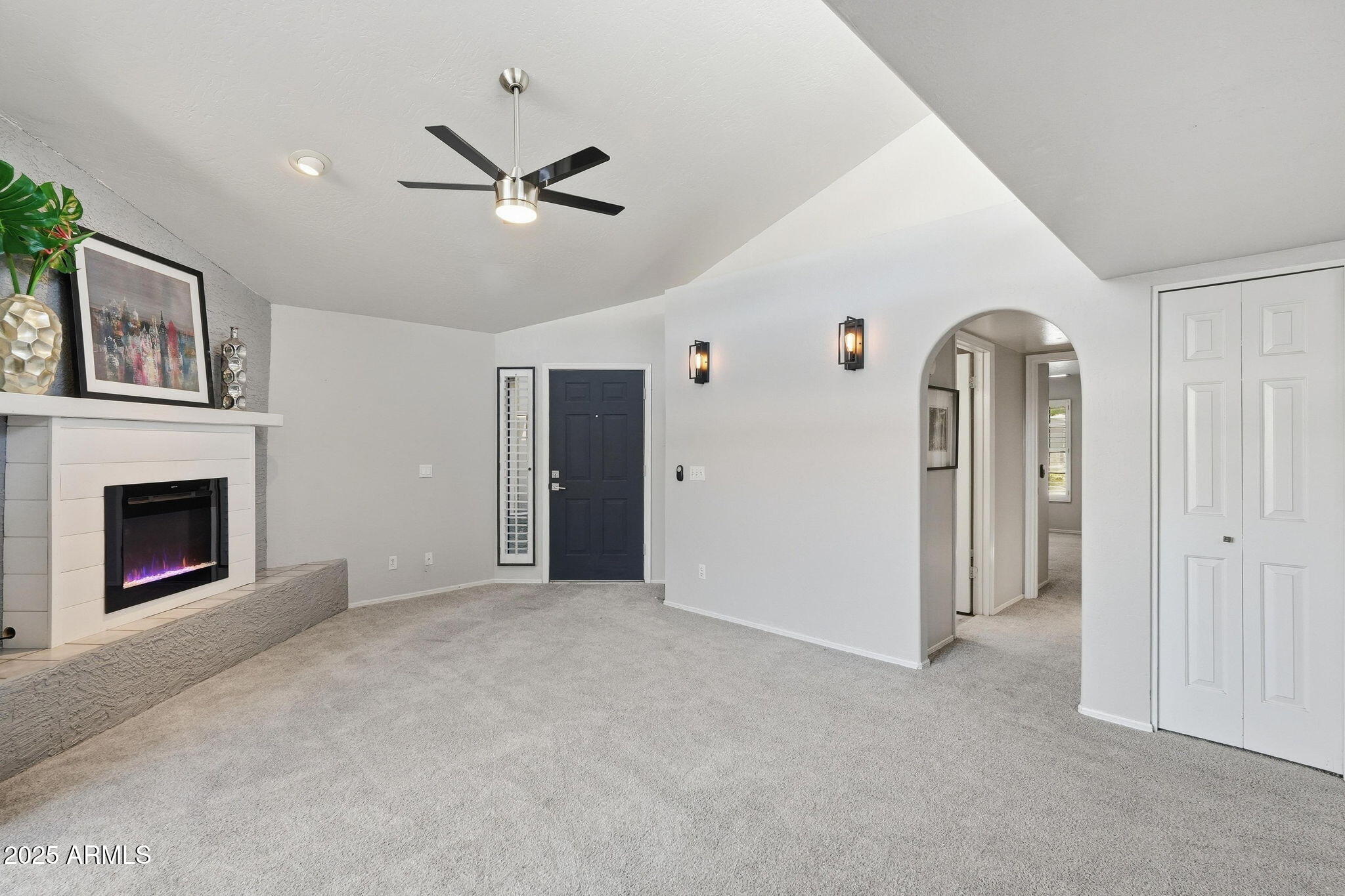18002 North 12th Street, Unit 26 Phoenix, AZ 85022 - Photo 4 of 25 a view of a livingroom with a fireplace