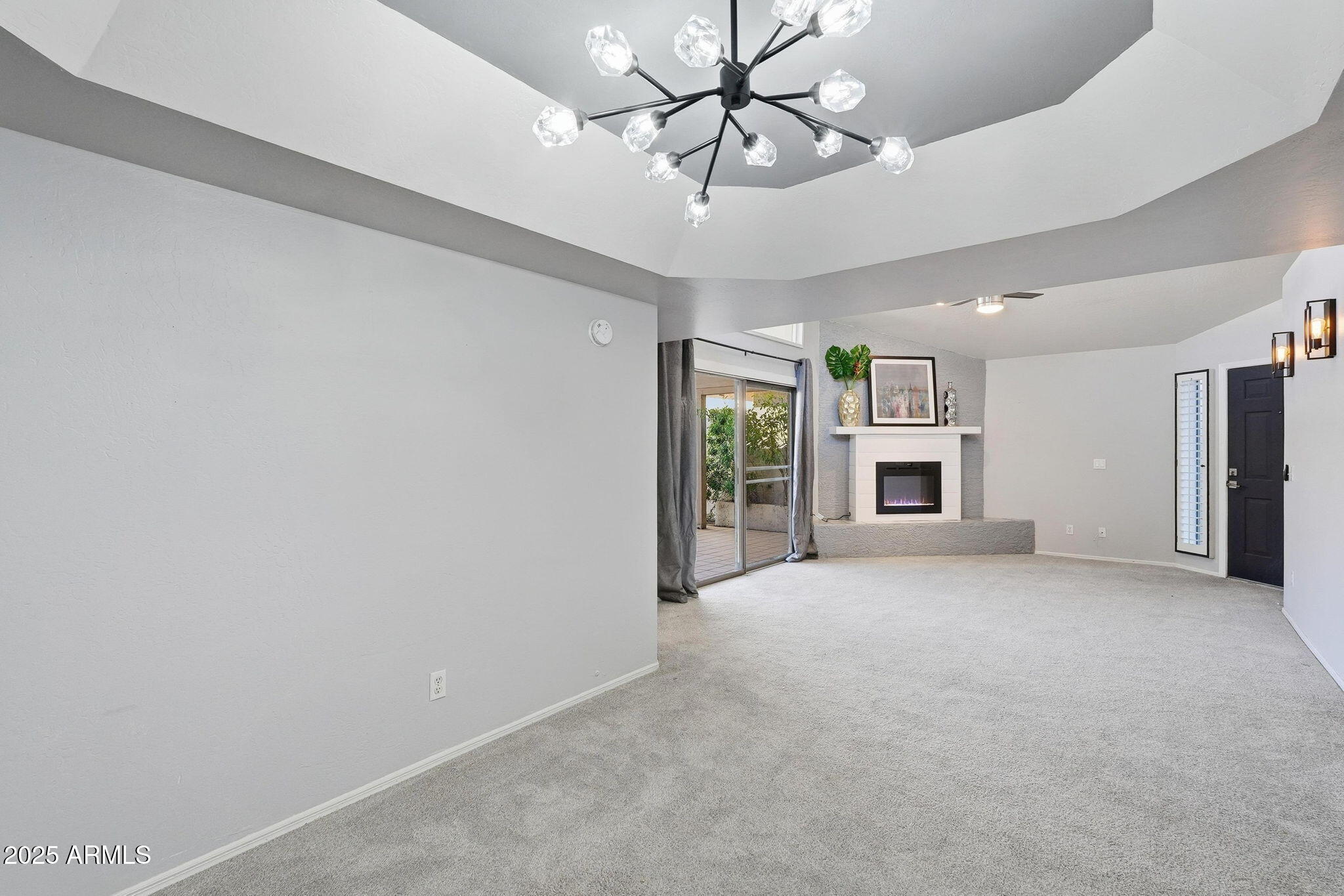 18002 North 12th Street, Unit 26 Phoenix, AZ 85022 - Photo 7 of 25 a view of a livingroom with a ceiling fan window and a ceiling fan