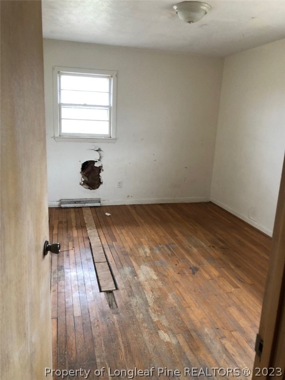 199 Herring Road Orrum, NC 28369 - Photo 17 of 20 a view of wooden floor in a room