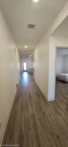 a view of gallery with wooden floor