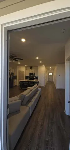 a lobby with a couch and a potted plant