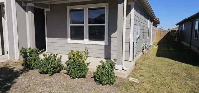 a view of a pathway besides a house