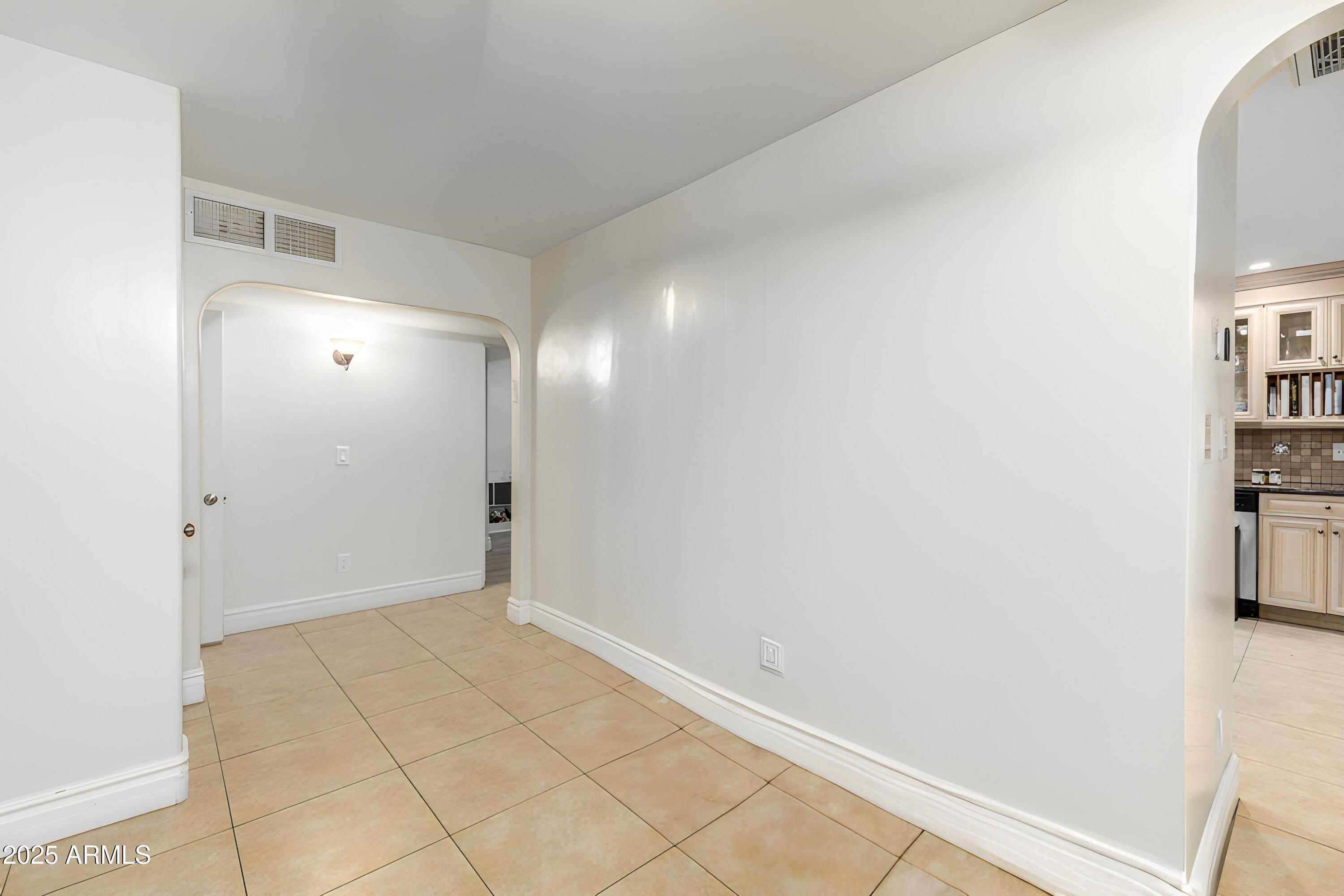 6842 North 10th Place Phoenix, AZ 85014 - Photo 11 of 60 a view of an empty room