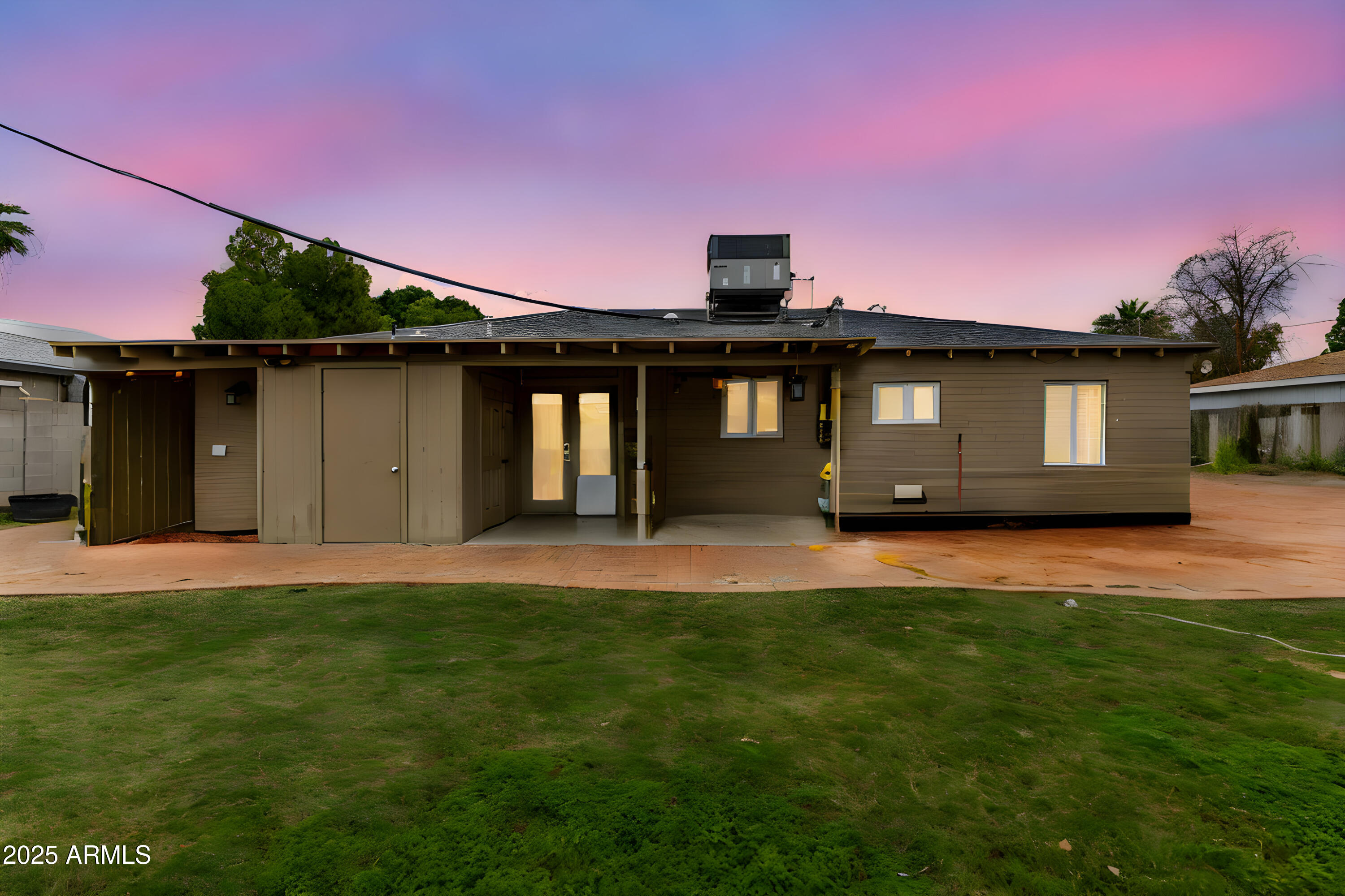6842 North 10th Place Phoenix, AZ 85014 - Photo 2 of 60 a front view of a house with a garden and yard